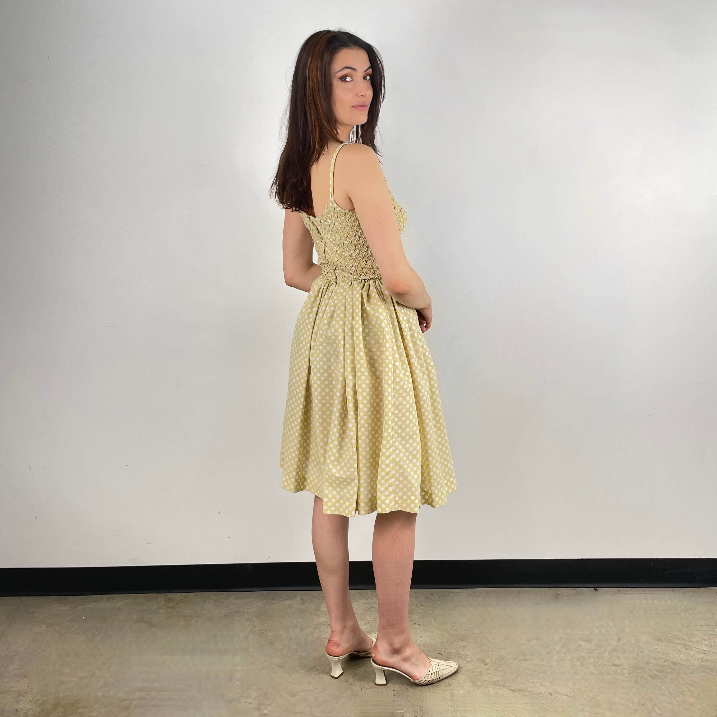Back view of 1950s Polka Dot Sleeveless Dress size Small sold at bohemevintage.com Montreal