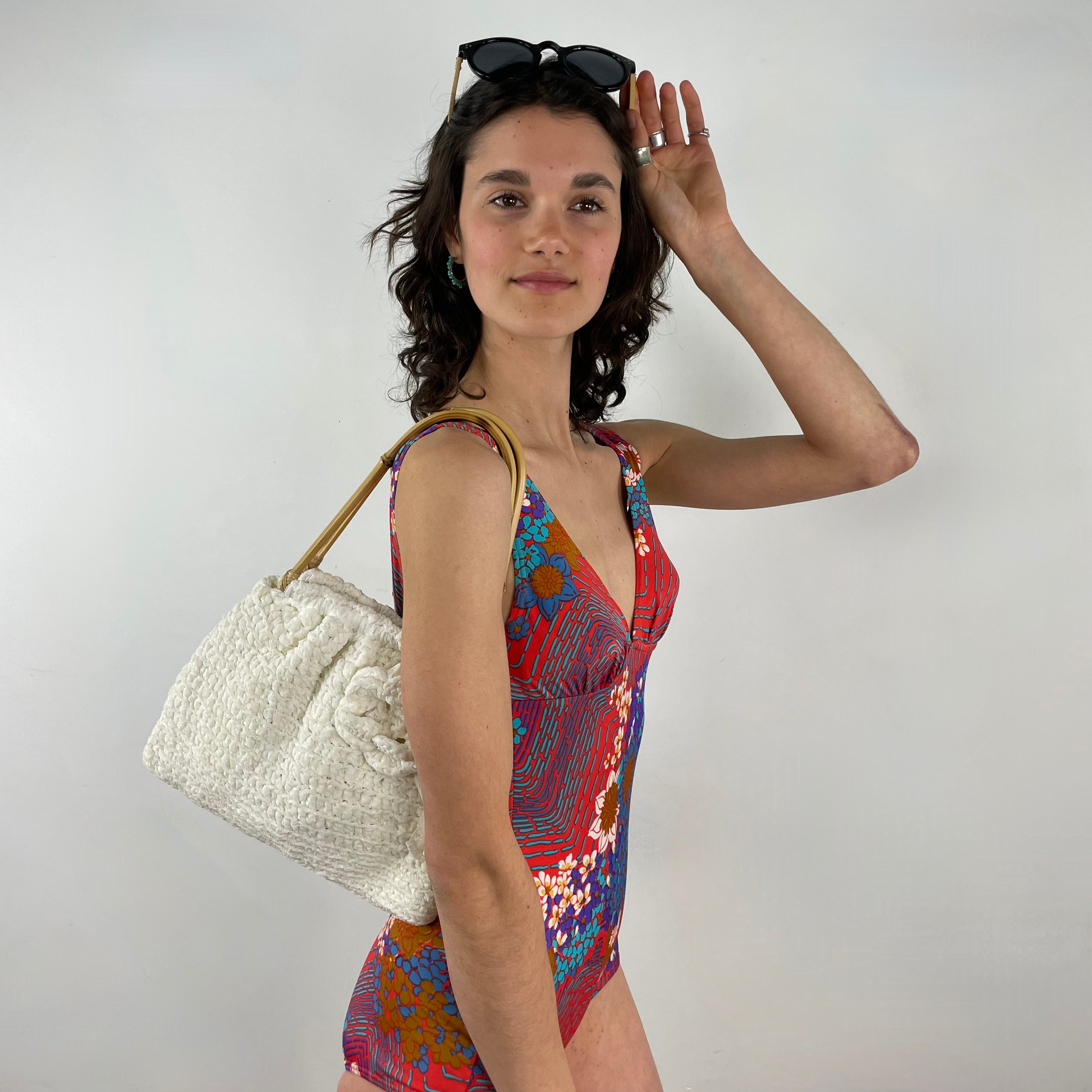 Side view of 1960s/70s One-piece Open Back Bathing Suit Size Small sold at bohemevintage.com, Montreal