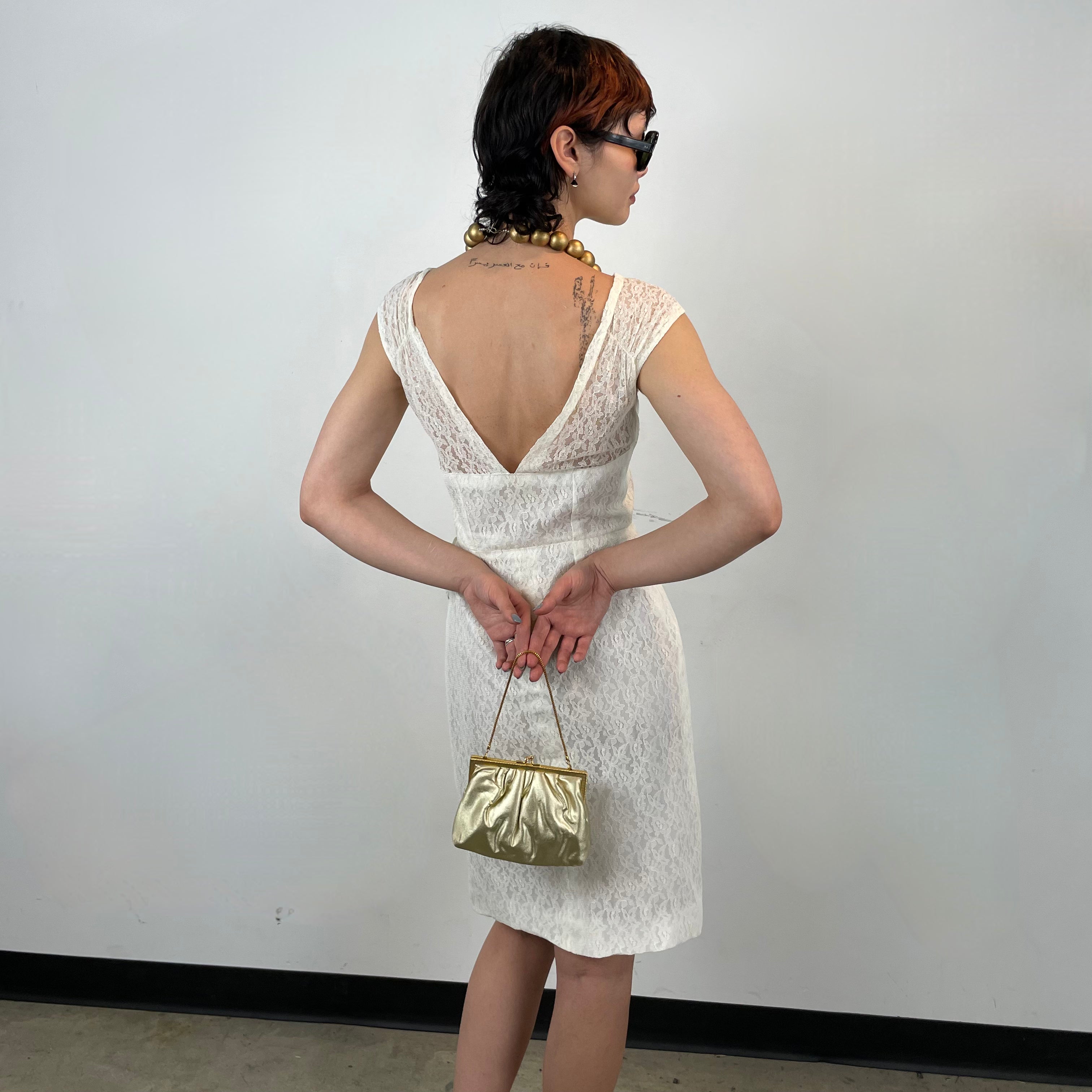 Back view of 1960s Ivory Lace Dress
Size Small
Sold at bohemevintage.com
Montréal