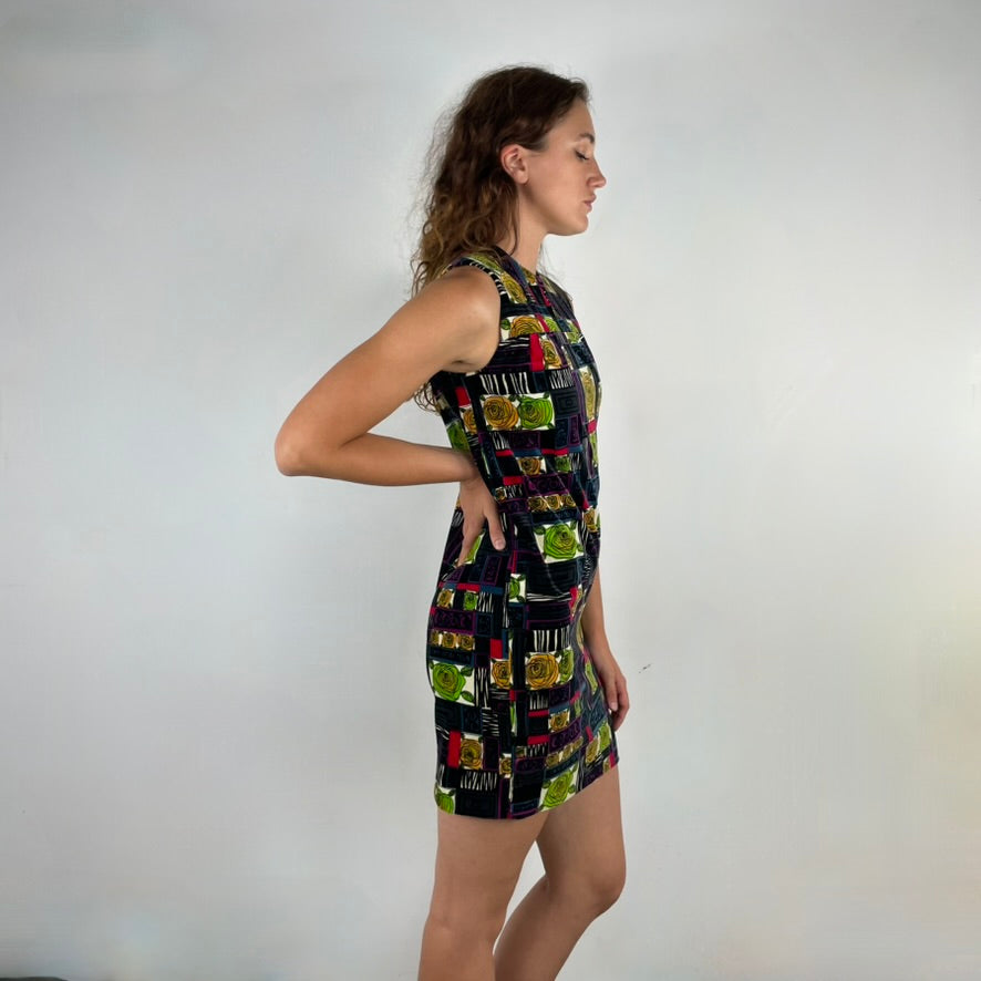 Side view of 1960s Rose Motifs Velvet Shift Dress
Size Small/Medium
Sold at bohemevintage.com Montréal