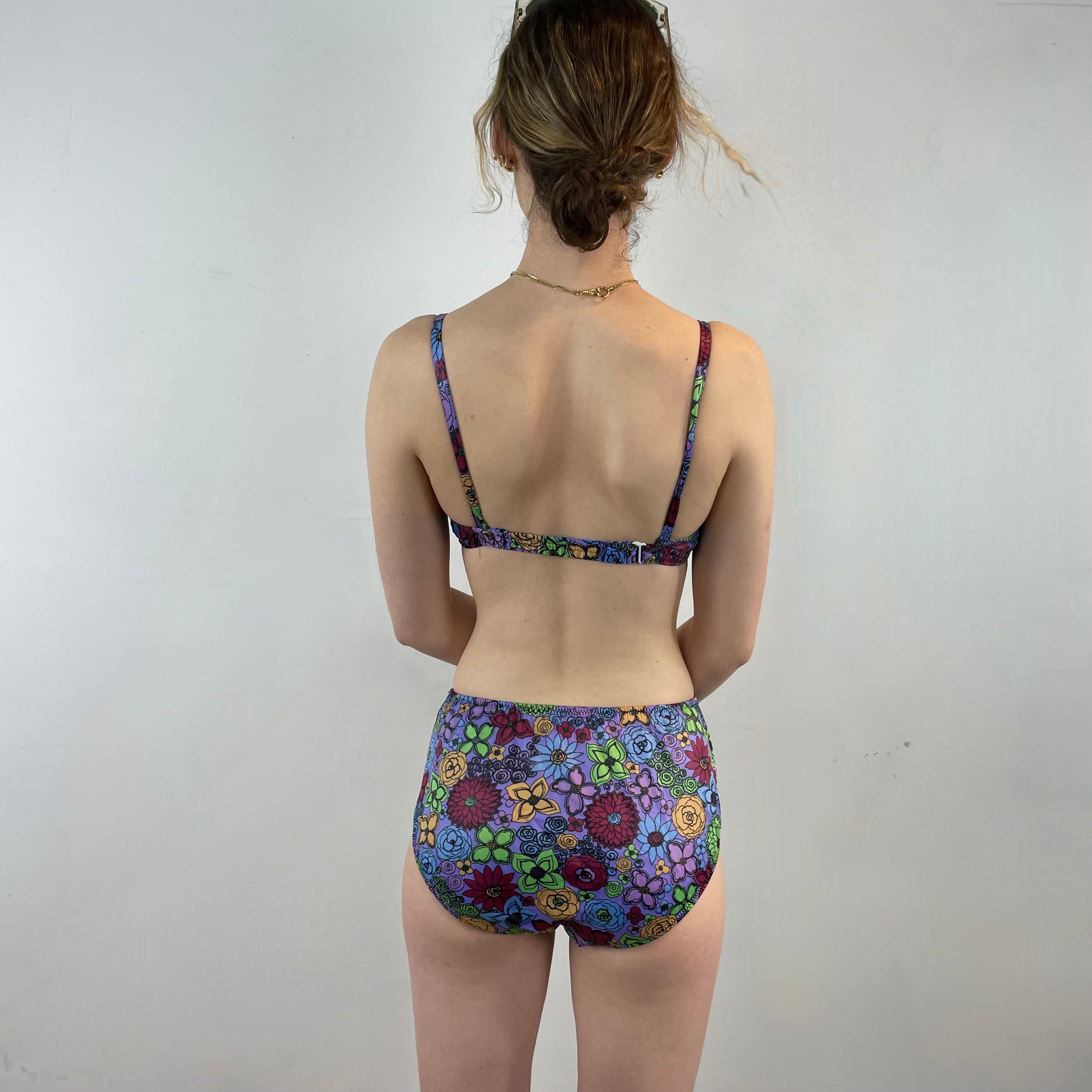 Boheme Vintage 1960s Smart Brassière floral two-piece swimsuit with underwire top, adjustable straps, and mid-rise bottoms.