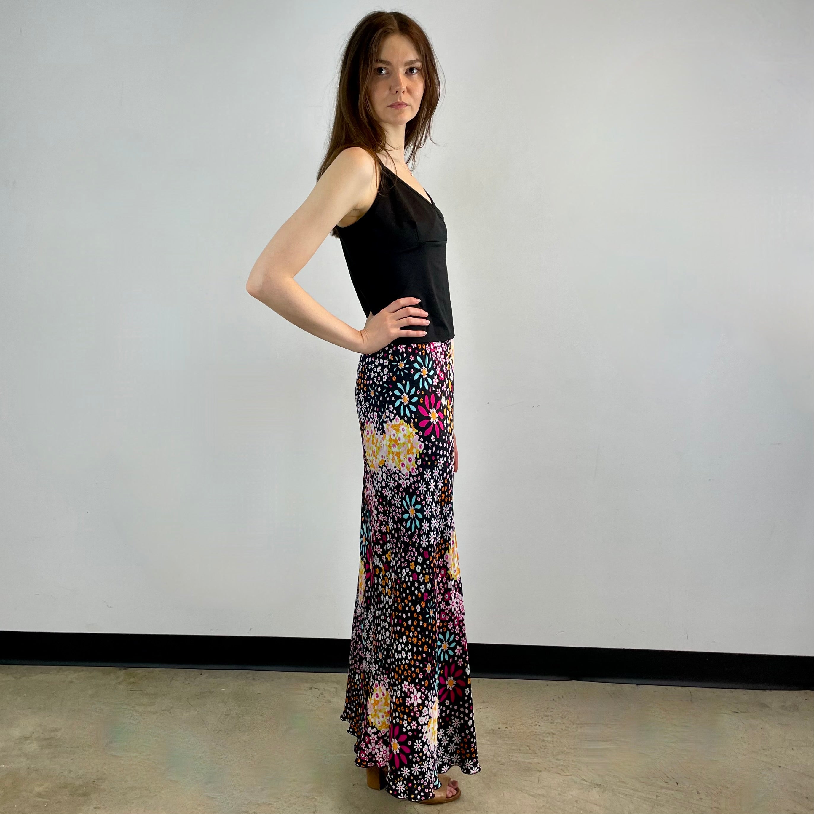 Vintage 1970s Ana Sanchez flared maxi skirt in dark colorful retro print, made from 100% viscose with an elastic waistband and knee-length lining.