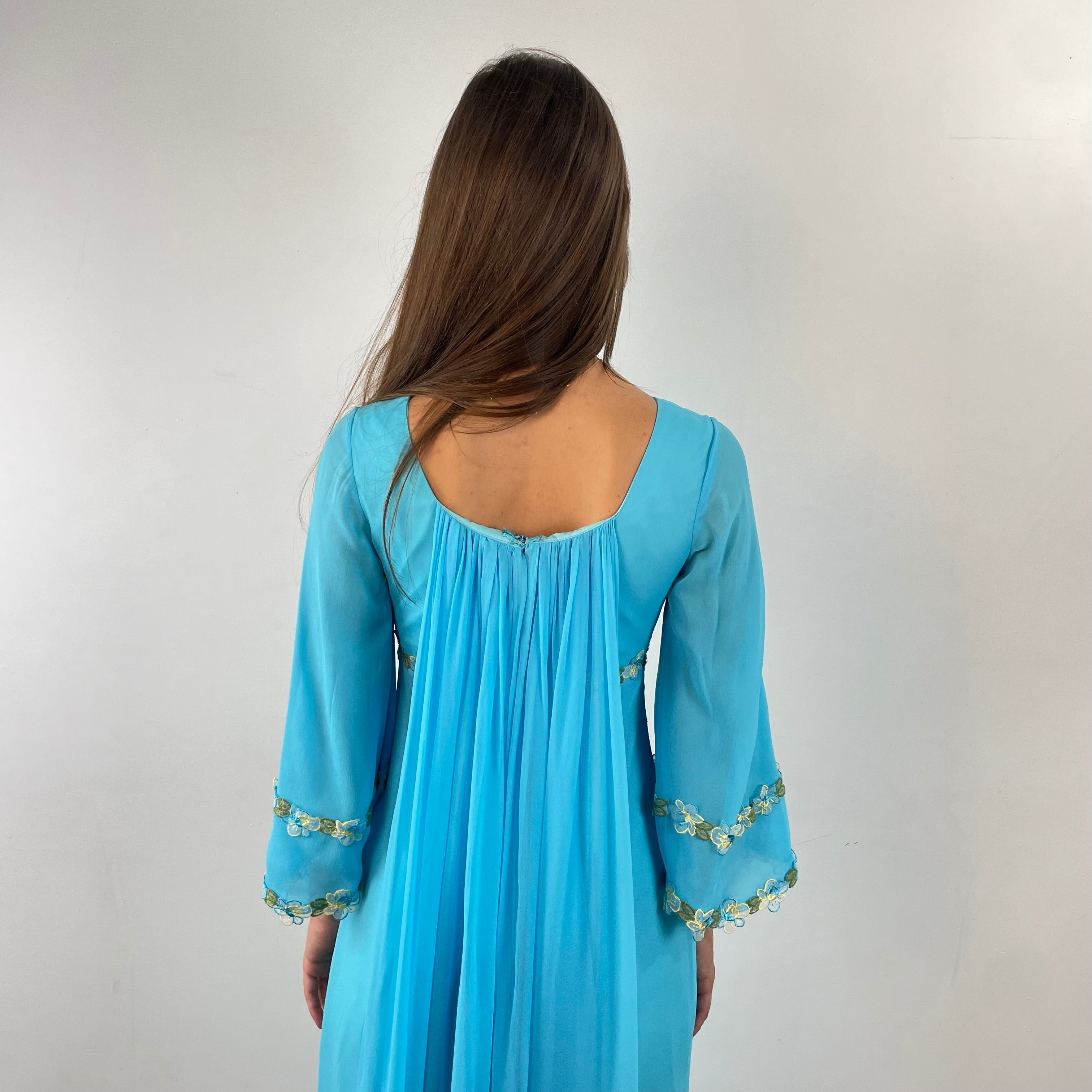Back detail view of 1970s Turquoise Silk Chiffon Long-Sleeved Maxi Dress Small sold on bohemevintage.com Montreal