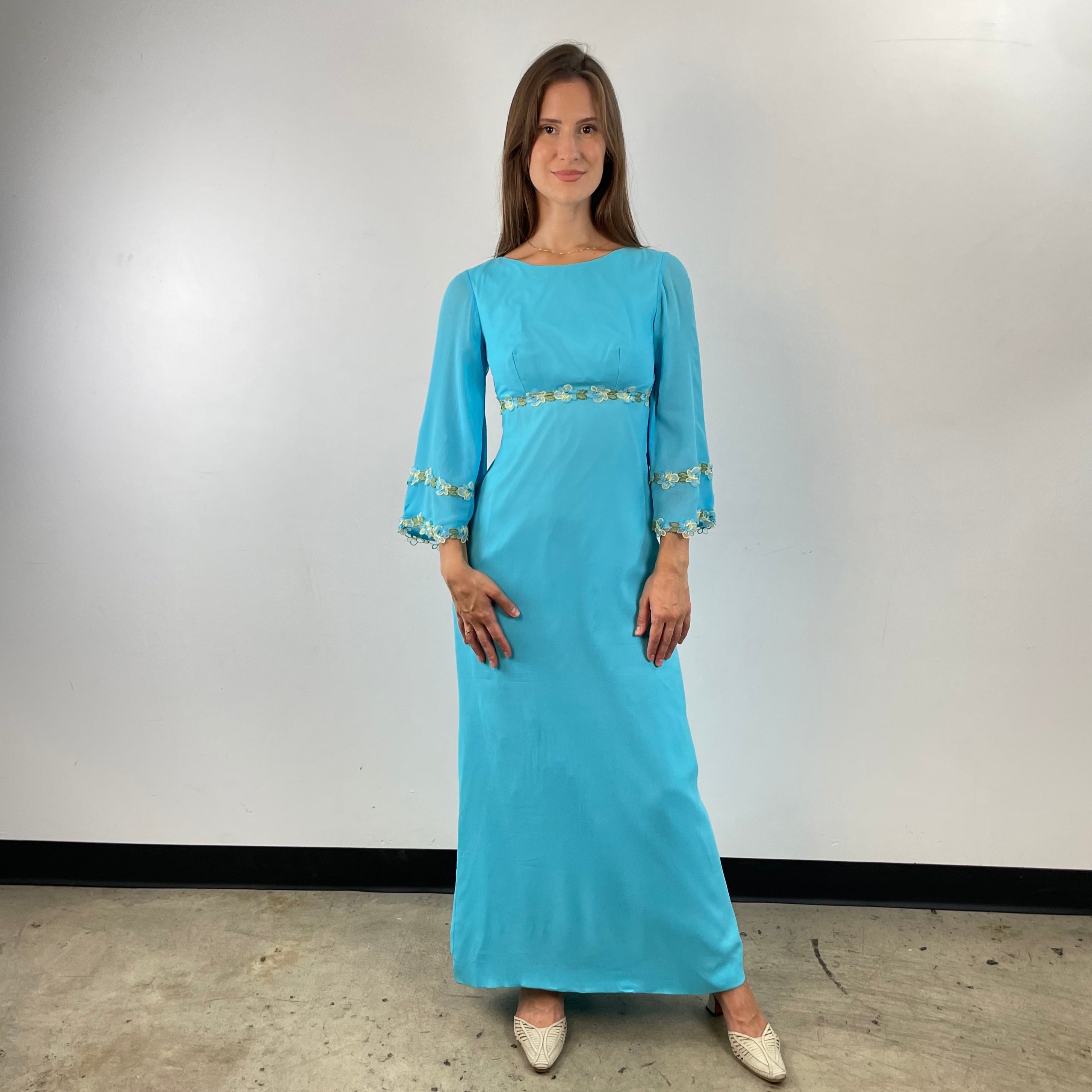 Front view of 1970s Turquoise Silk Chiffon Long-Sleeved Maxi Dress Small sold on bohemevintage.com Montreal