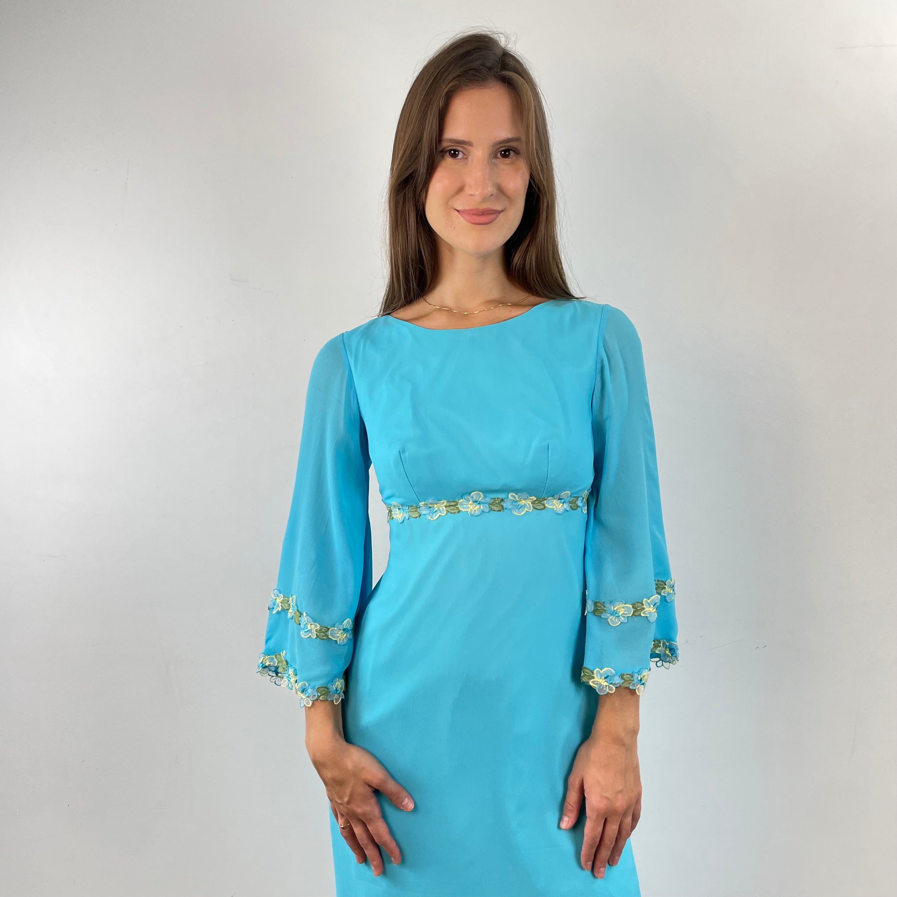 Front detail view of 1970s Turquoise Silk Chiffon Long-Sleeved Maxi Dress Small sold on bohemevintage.com Montreal