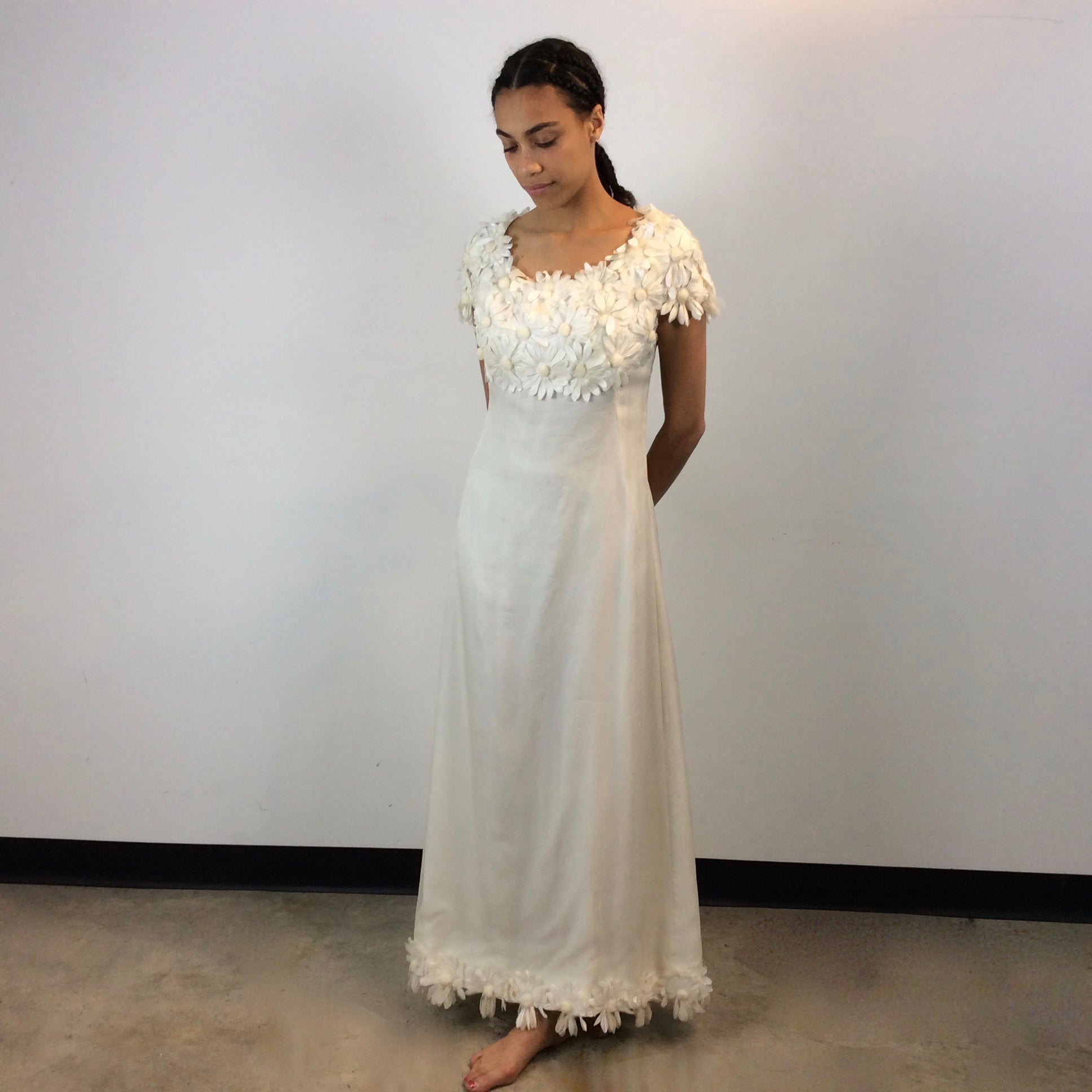 Front view of 1970s Daisy Embellished Ivory Organza Maxi Dress
Size Small
Sold at bohemevintage.com
Montréal