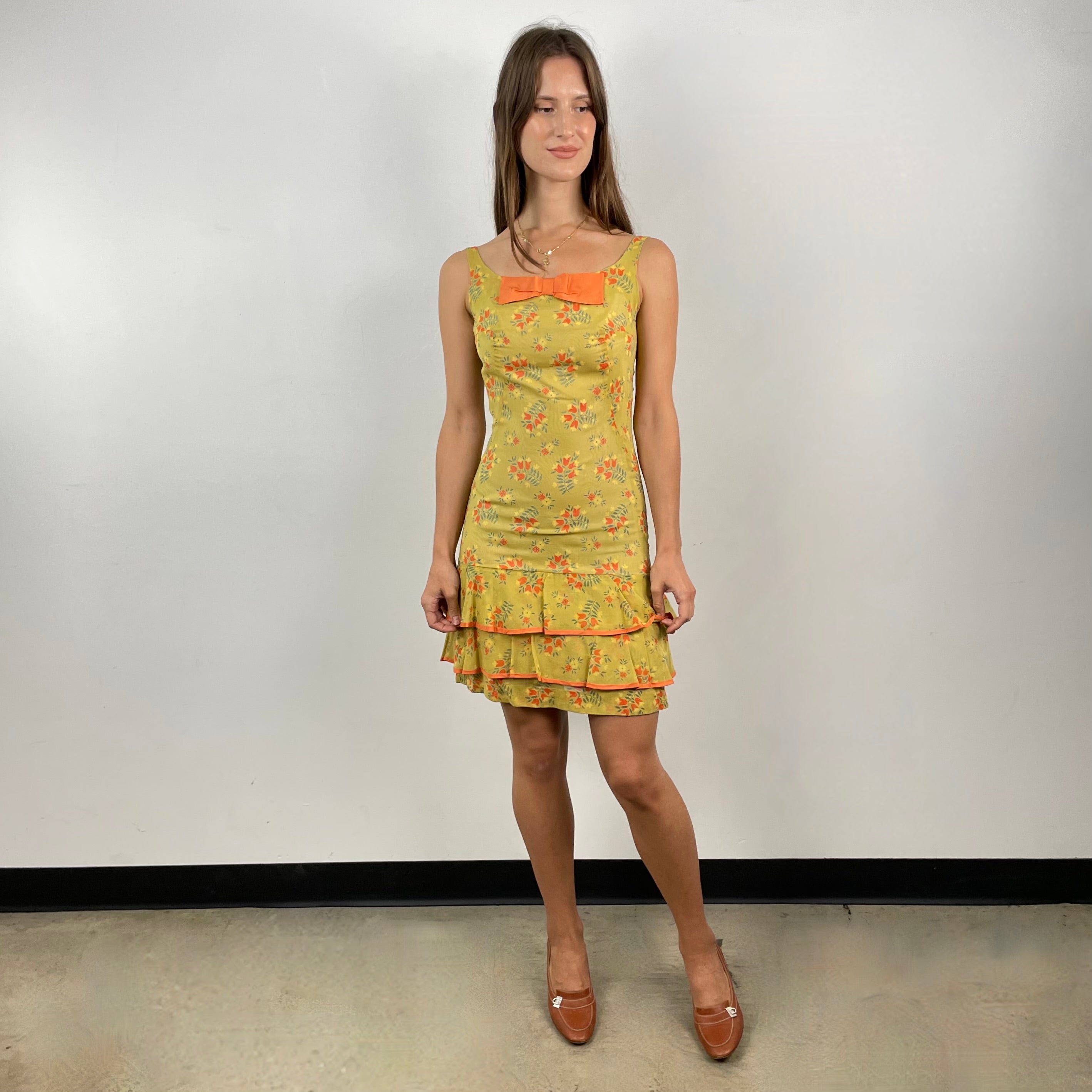 Front View of Boheme Vintage 1970s handmade sheath dress with scoop neckline, bow detail, and flounced hem.