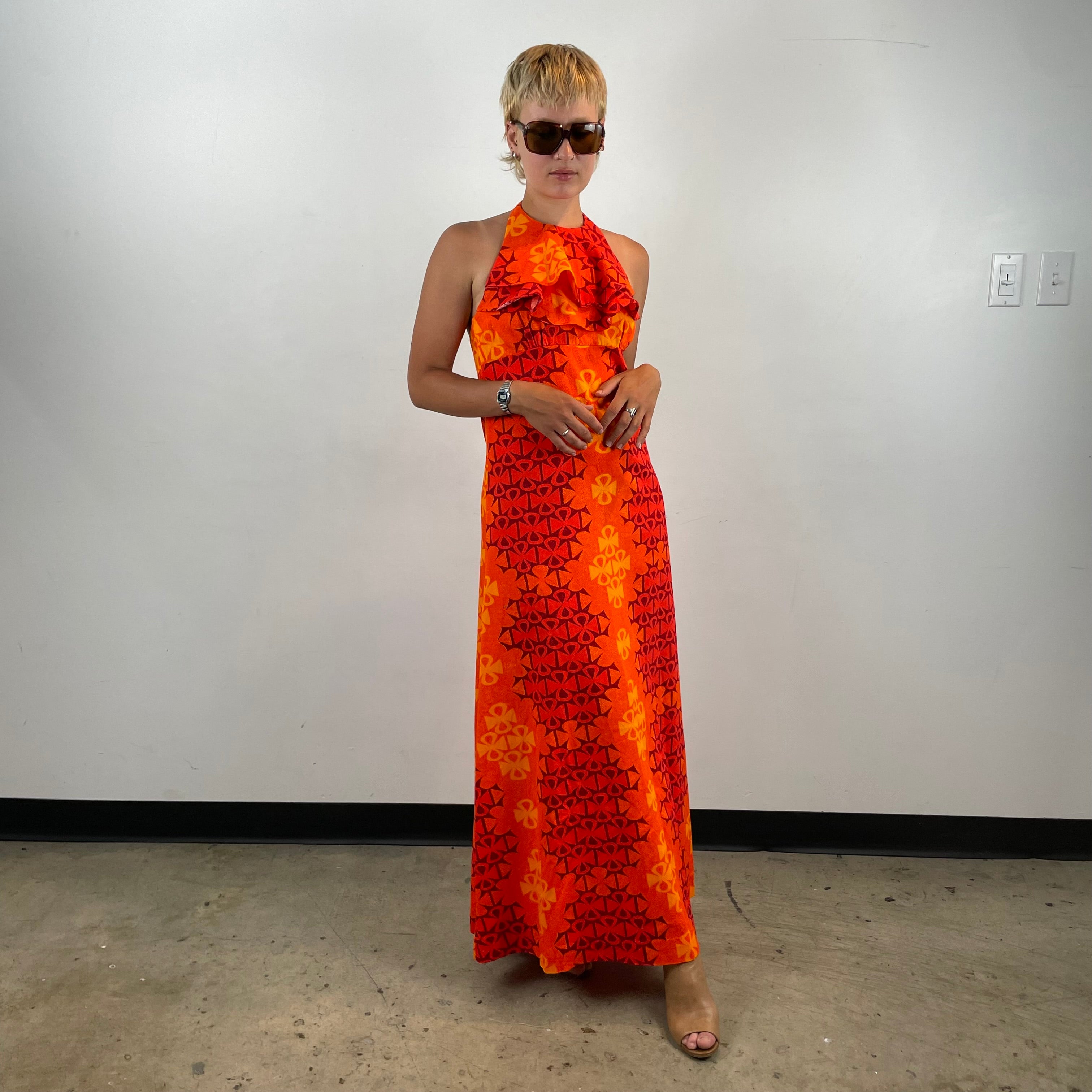 Boheme Vintage 1970s Paradise Isle Hawaiian cotton halter maxi dress with tropical print, empire waist, and flounced neckline.