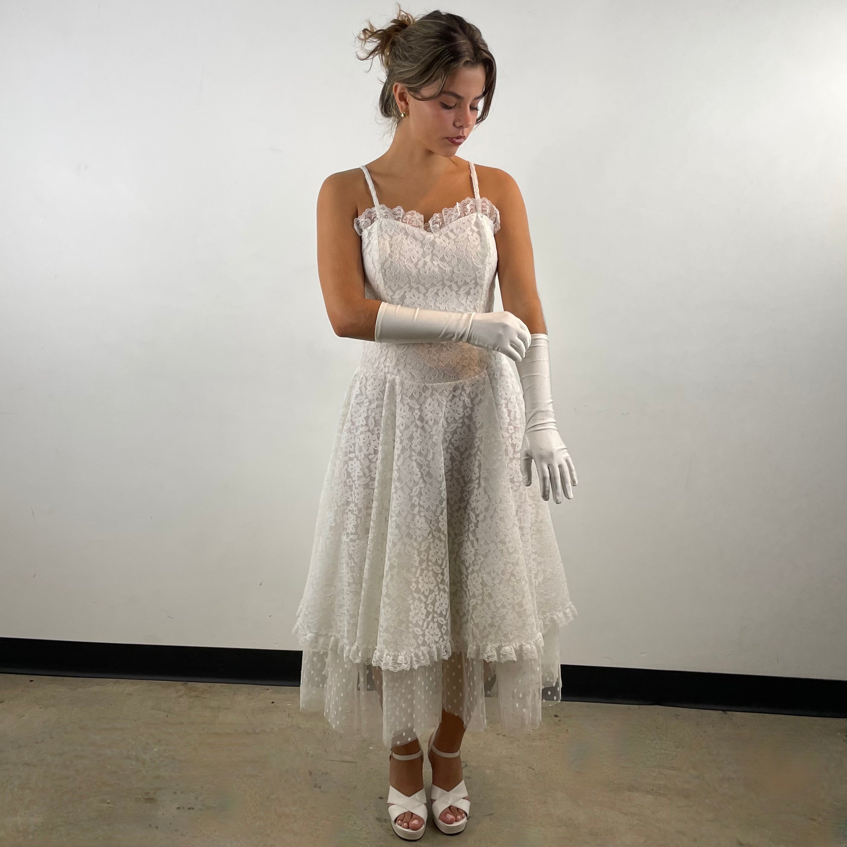 Boheme Vintage 1990s Algo Boutique white lace bustier dress with narrow straps, flared skirt, and layered tulle hem.