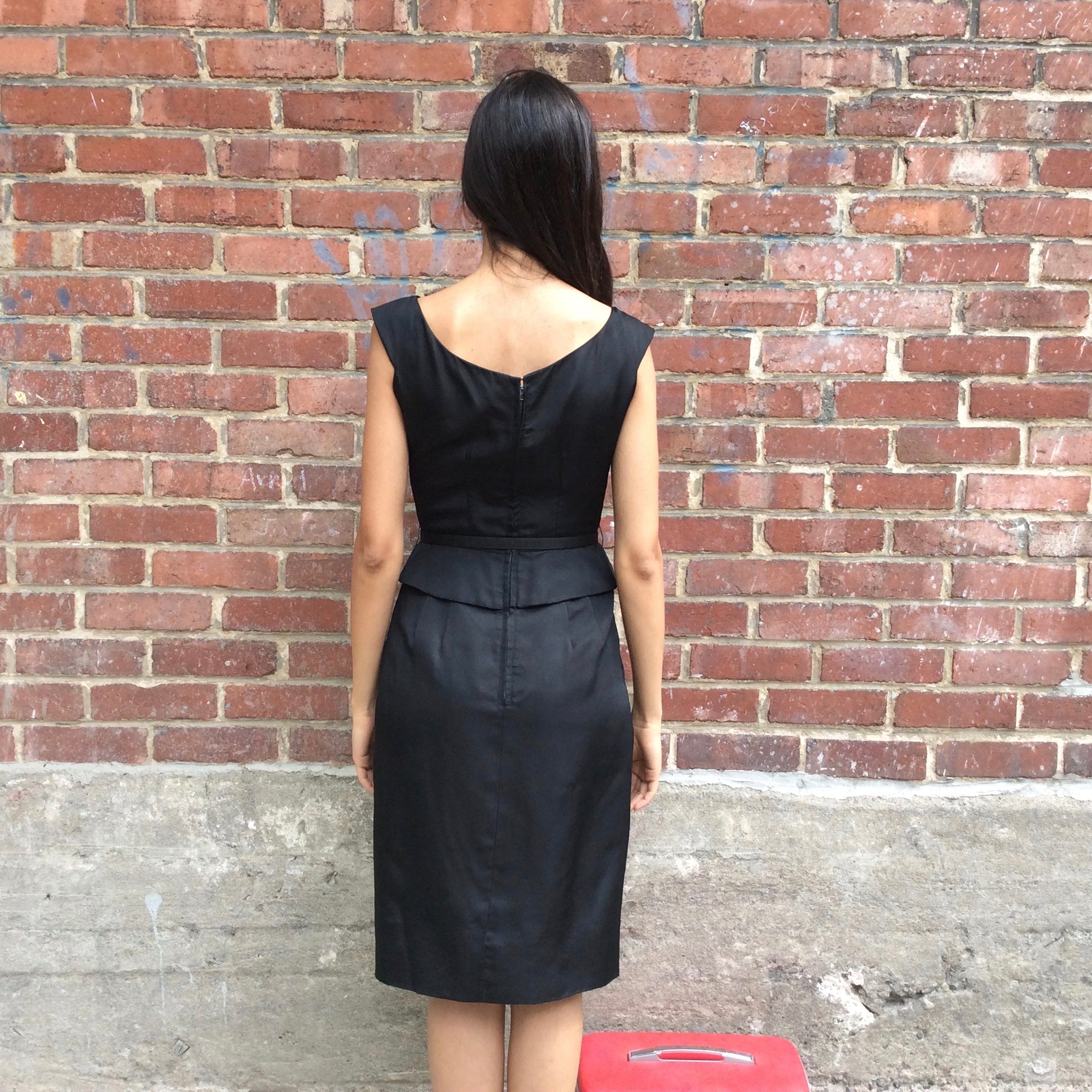 Back view of 1950s Black Dress With Peplum
Size Extra-Small/Small
Sold at bohemevintage.com
Montréal