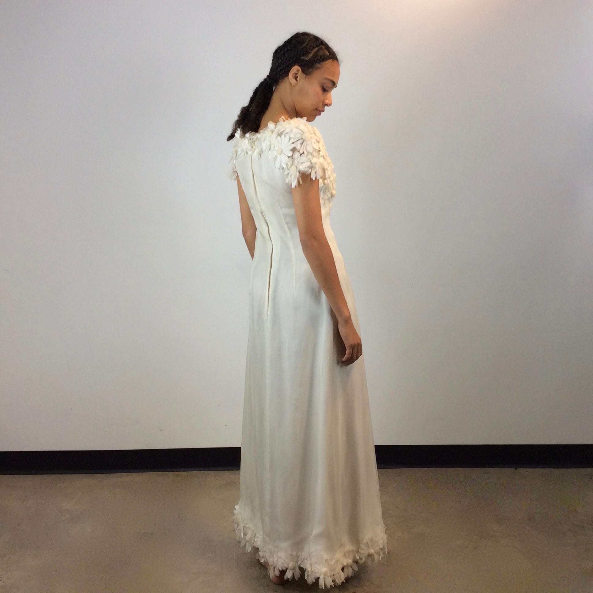 Back view of 1970s Daisy Embellished Ivory Organza Maxi Dress
Size Small
Sold at bohemevintage.com
Montréal