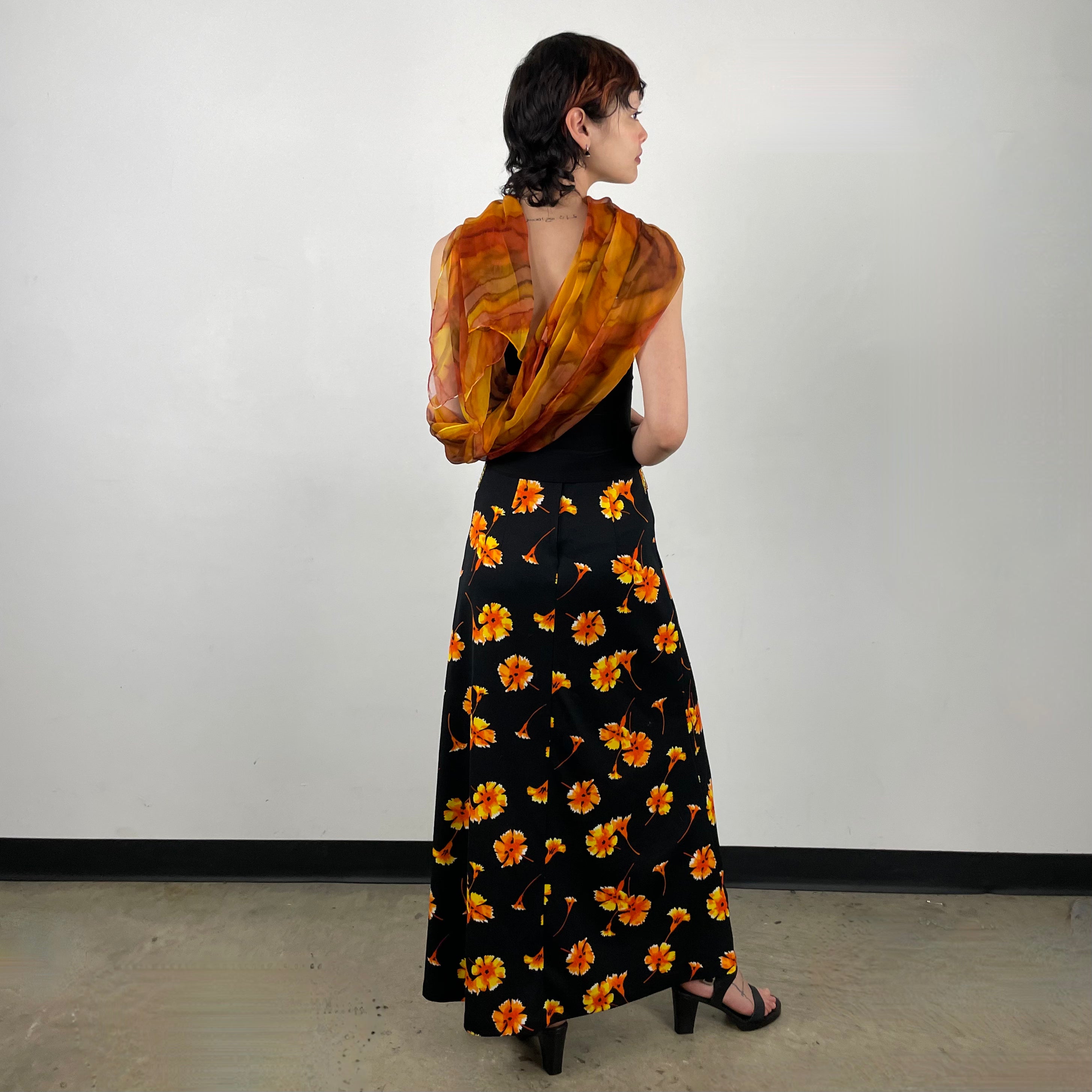 Back view of 70s Black Floral Printed Maxi Skirt
Size Extra Small/Small
Sold at bohemevintage.com
Montréal