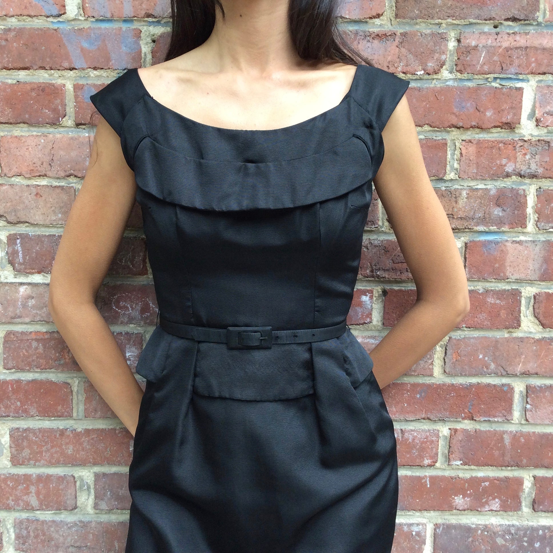 Close up front view of 1950s Black Dress With Peplum
Size Extra-Small/Small
Sold at bohemevintage.com
Montréal