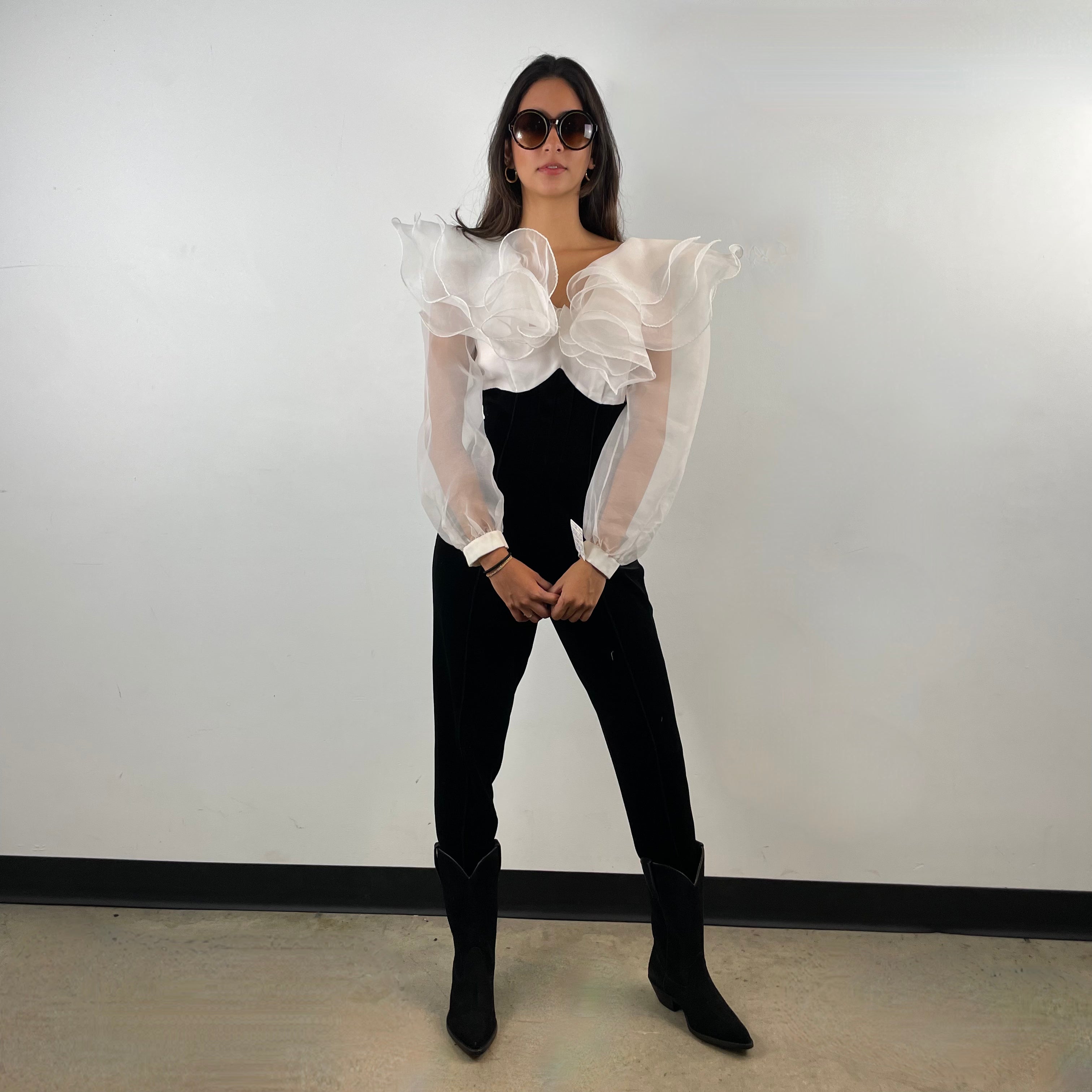 Front view of 1980s Ruffle Collar Stirrup Jumpsuit
Size Small
Sold at bohemevintage.com Montréal