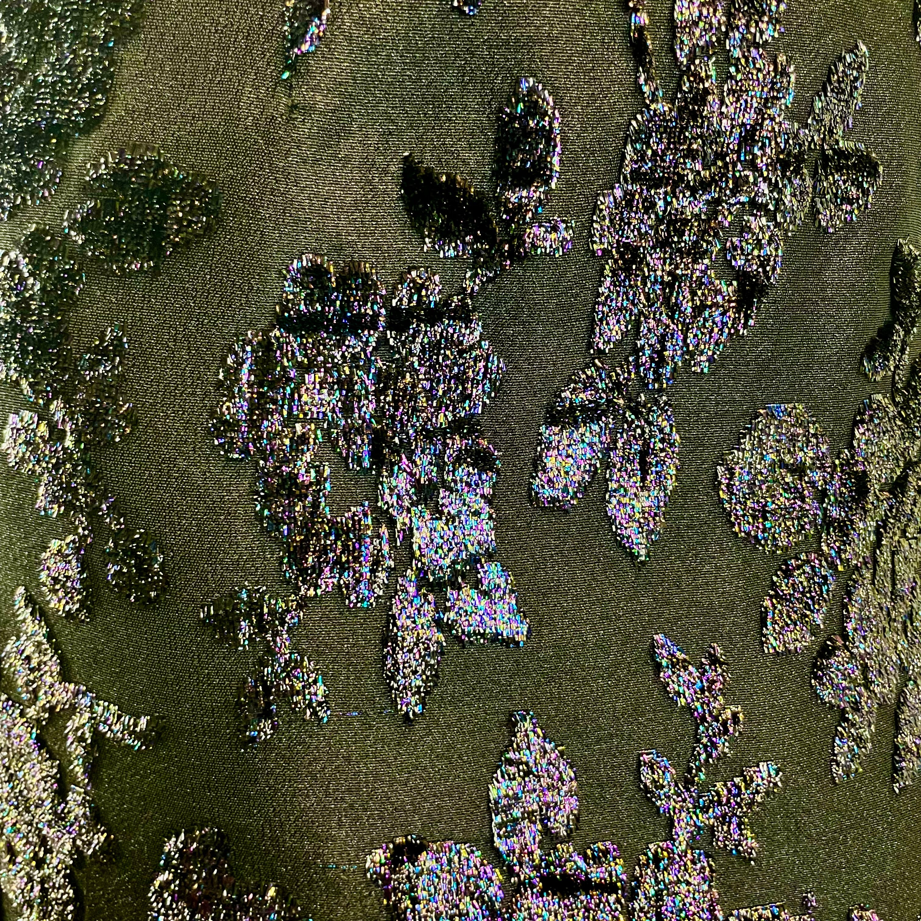 Close up view of brocade fabric of 1950s-1960s Floral Brocade Black Iridescent Cocktail Dress Size Medium sold at bohemevintage.com Montreal