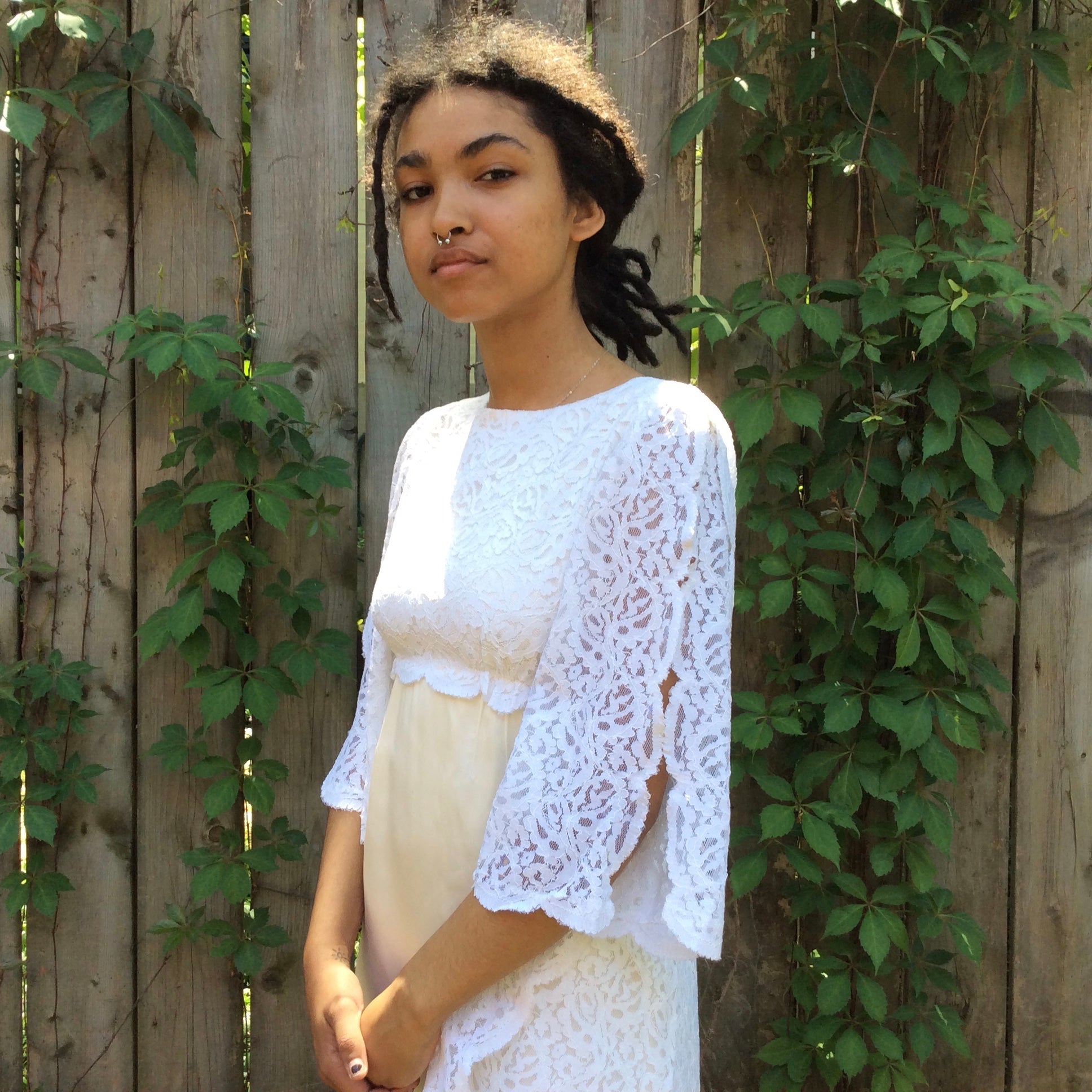 Side view of 1960s-1970s Ivory Wedding Gown with Train
Size extra small
sold at bohemevintage.com, Montréal