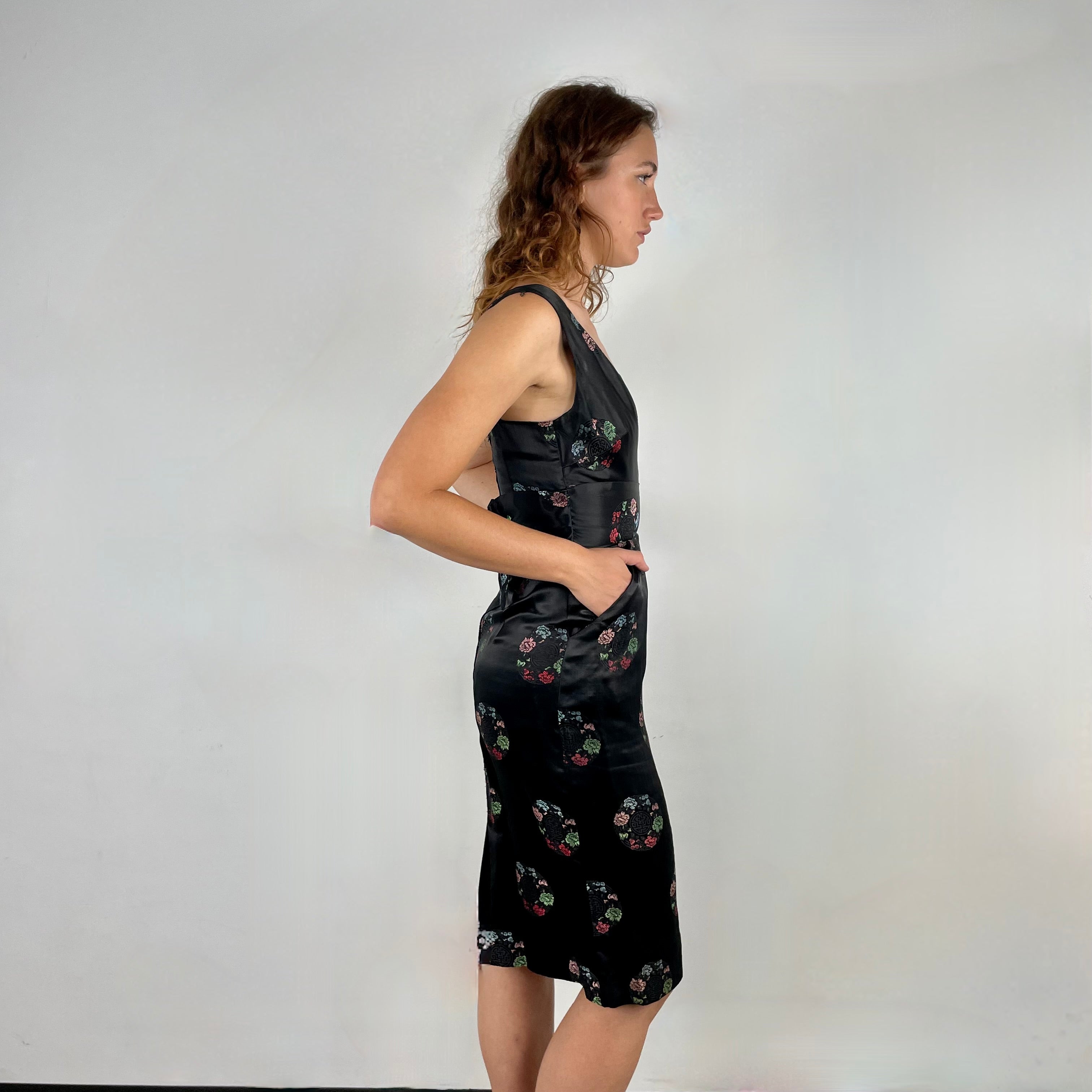 Side view of 1960s Black Satin Brocade Midi Dress
Size Small
Sold at bohemevintage.com
Montréal