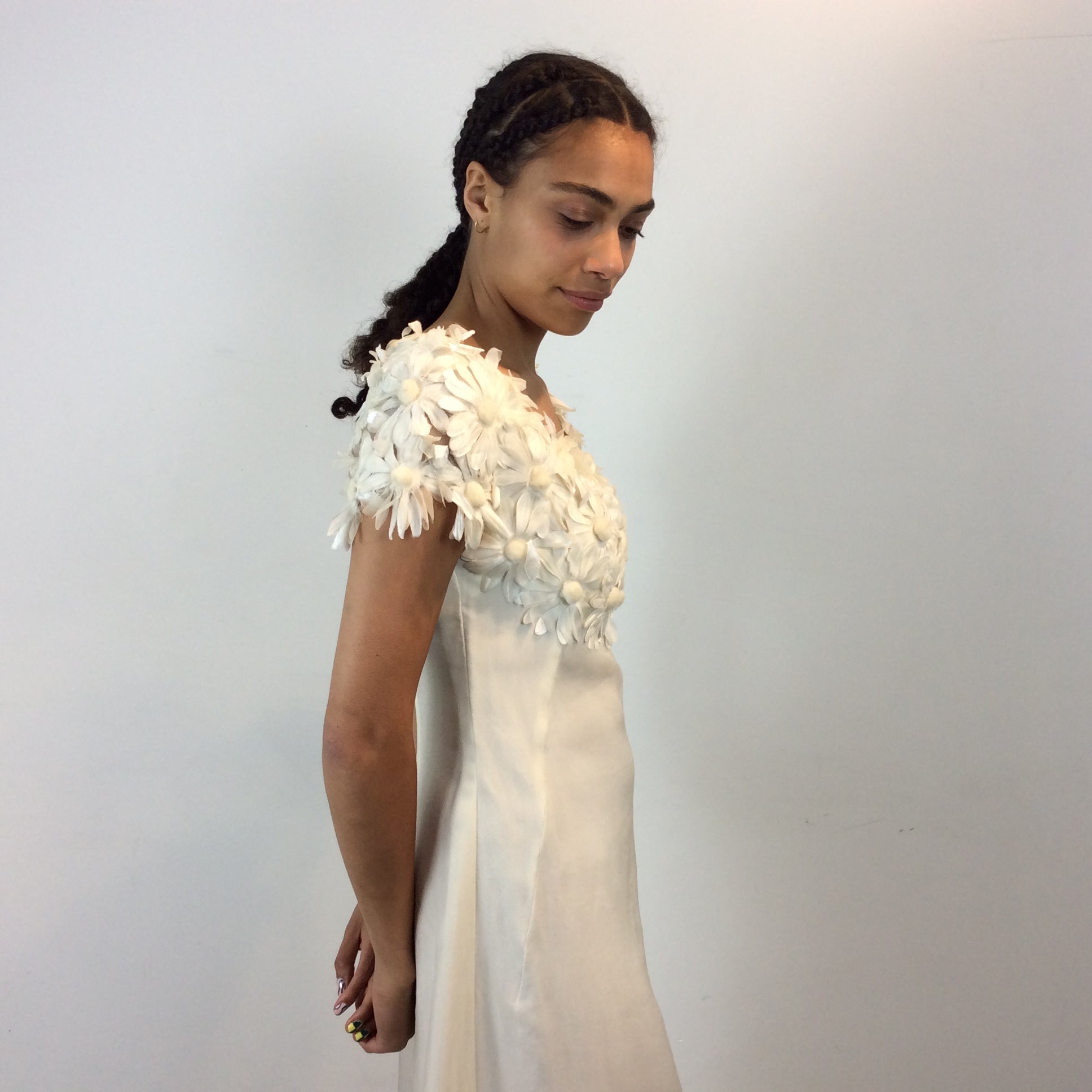 Close up side view of 1970s Daisy Embellished Ivory Organza Maxi Dress
Size Small
Sold at bohemevintage.com
Montréal