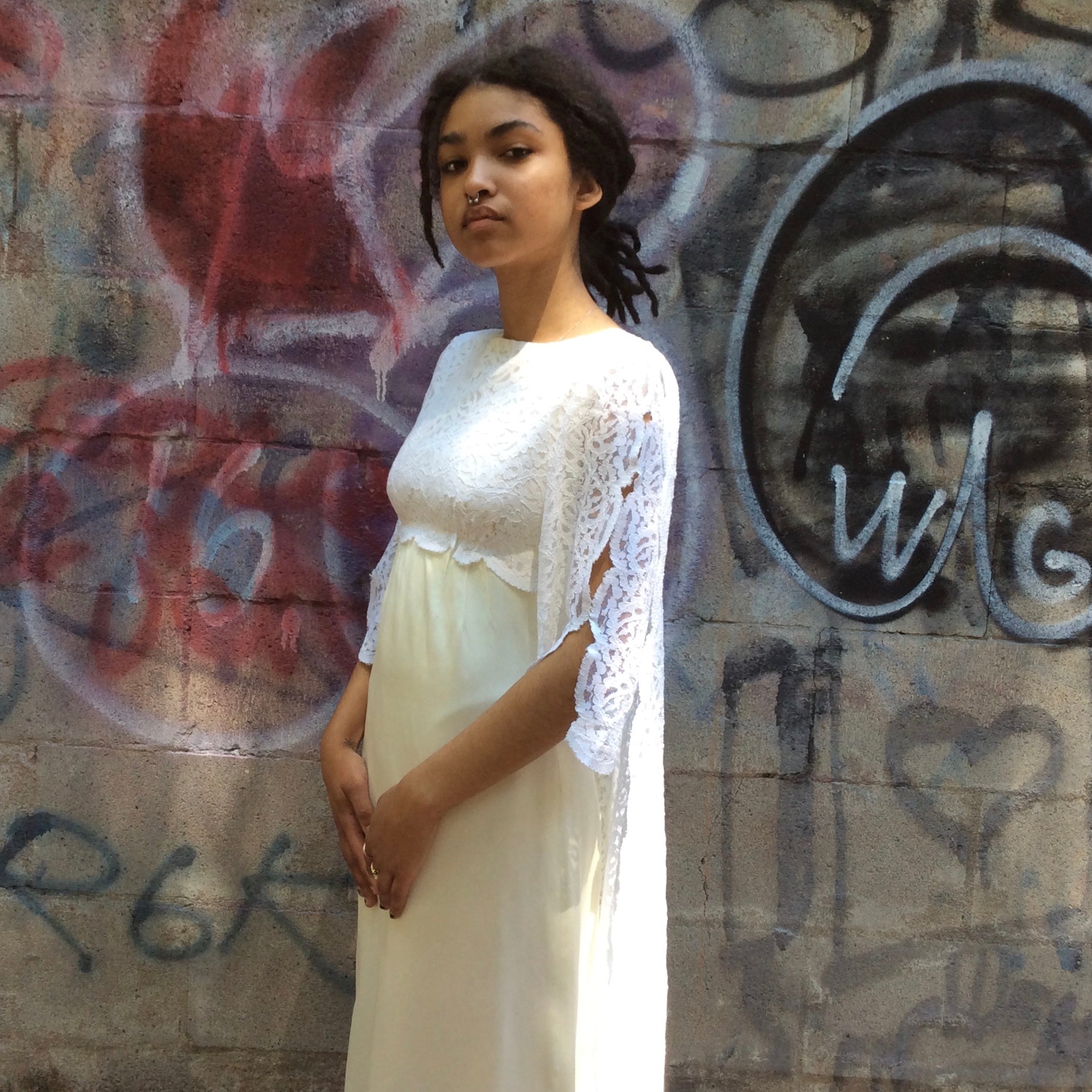 Side view of 1960s-1970s Ivory Wedding Gown with Train
Size extra small
sold at bohemevintage.com, Montréal