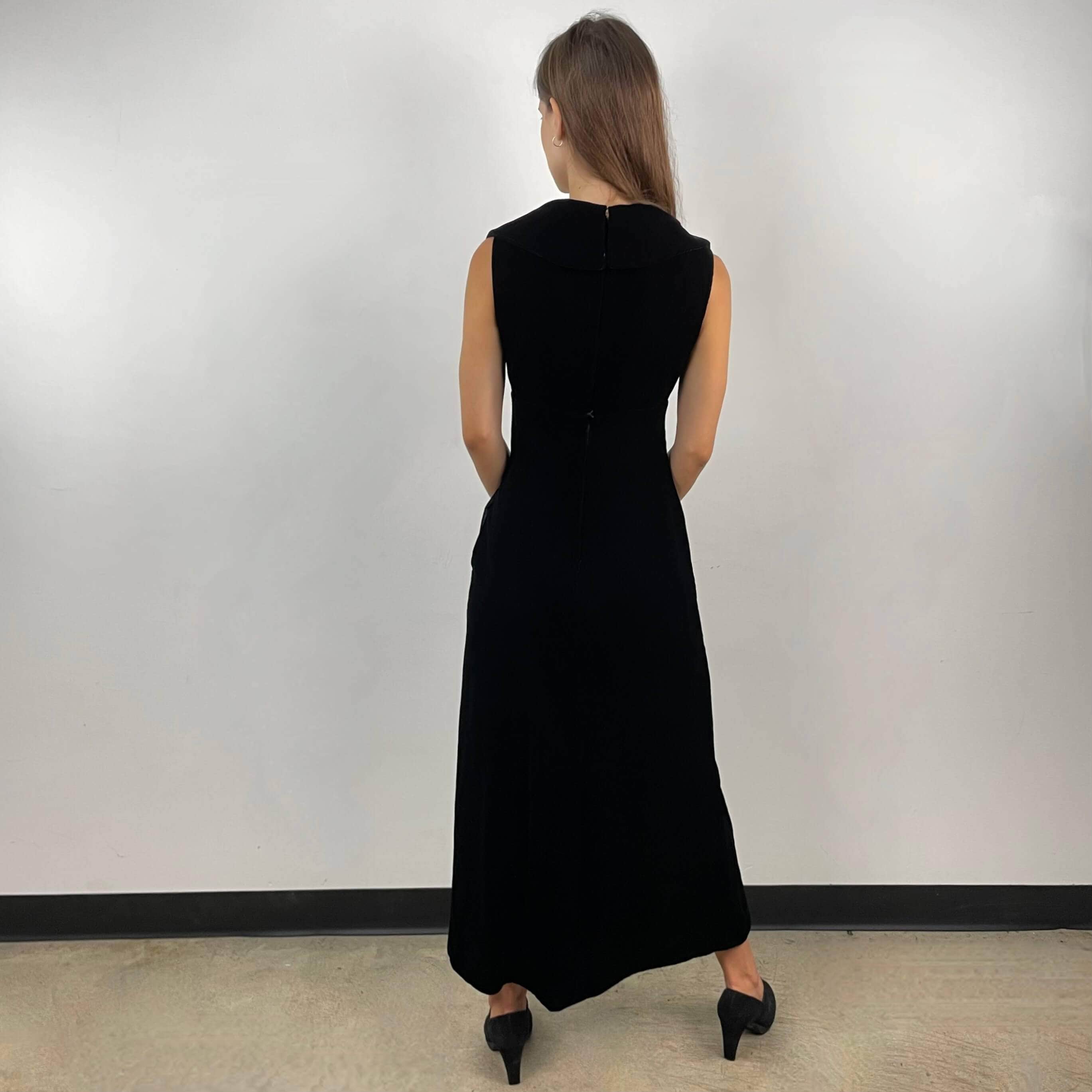 Back view of 1970s Deep V-Neck Black Velvet Midi Dress Size Small sold on bohemevintage.com Montreal