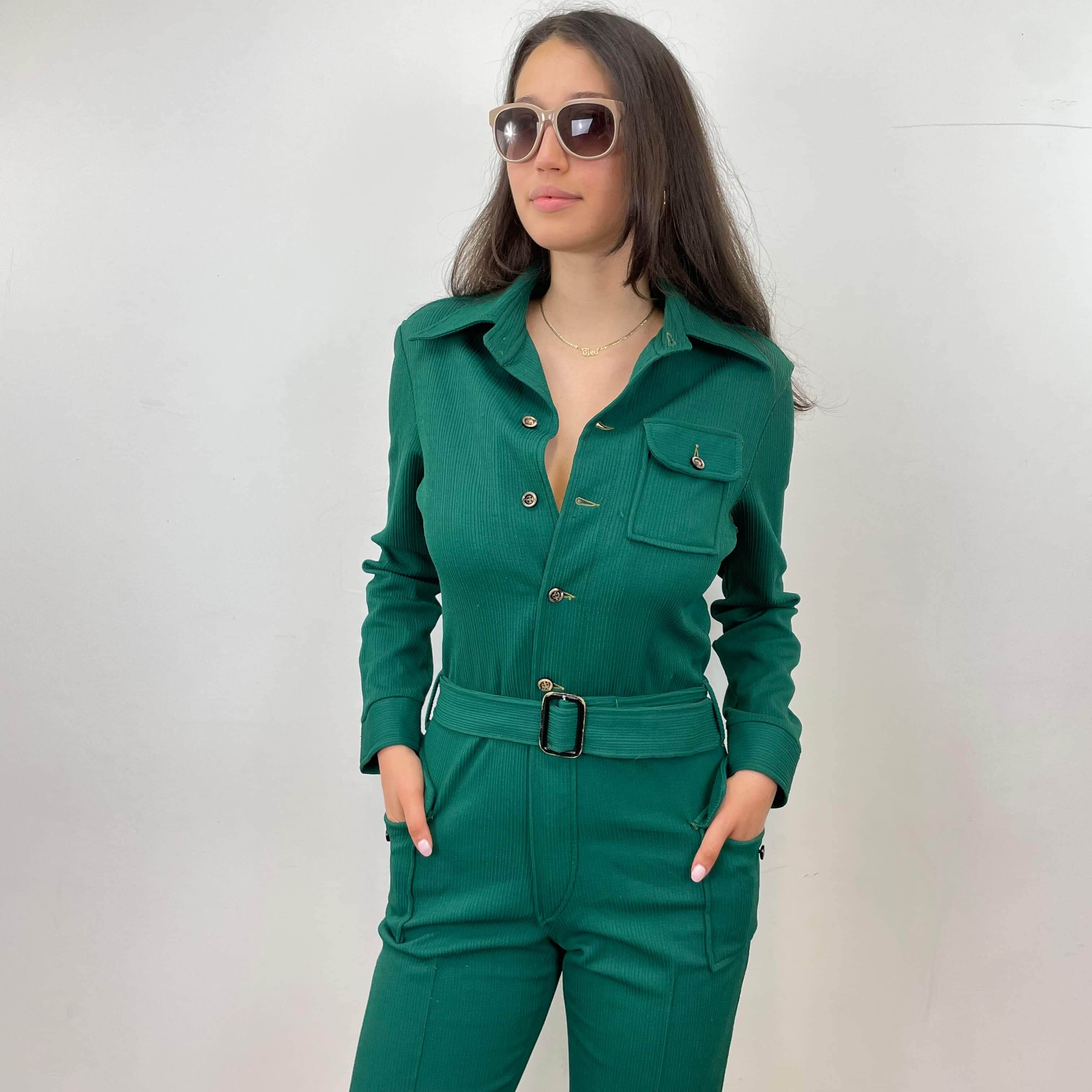 Front view of 1970s Long Sleeve Green Jumpsuit Size Medium sold on bohemevintage.com Montreal