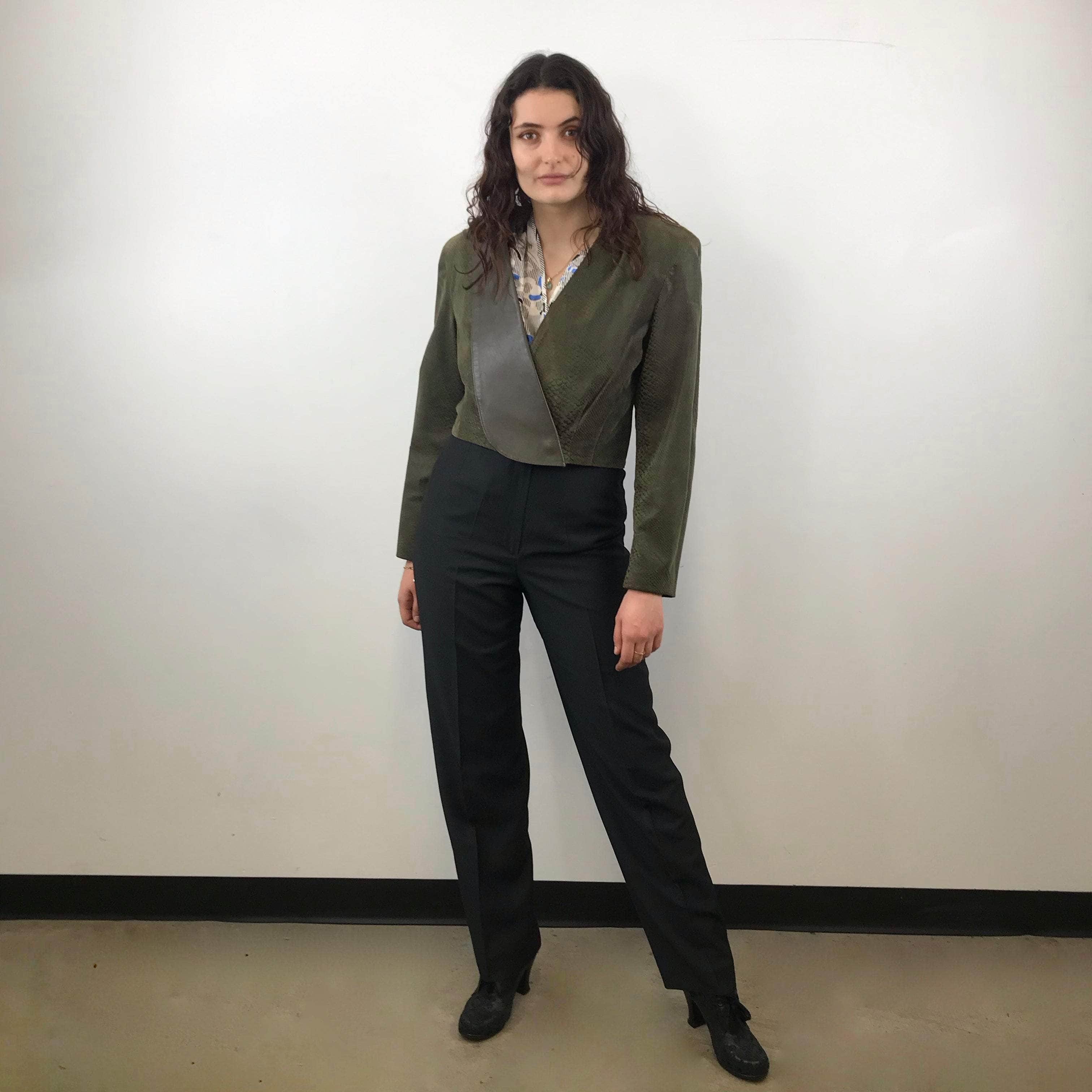 Front view of 1980s Danier Cropped Leather Jacket size Medium paired with straight leg black trousers sold at bohemevintage.com Montreal