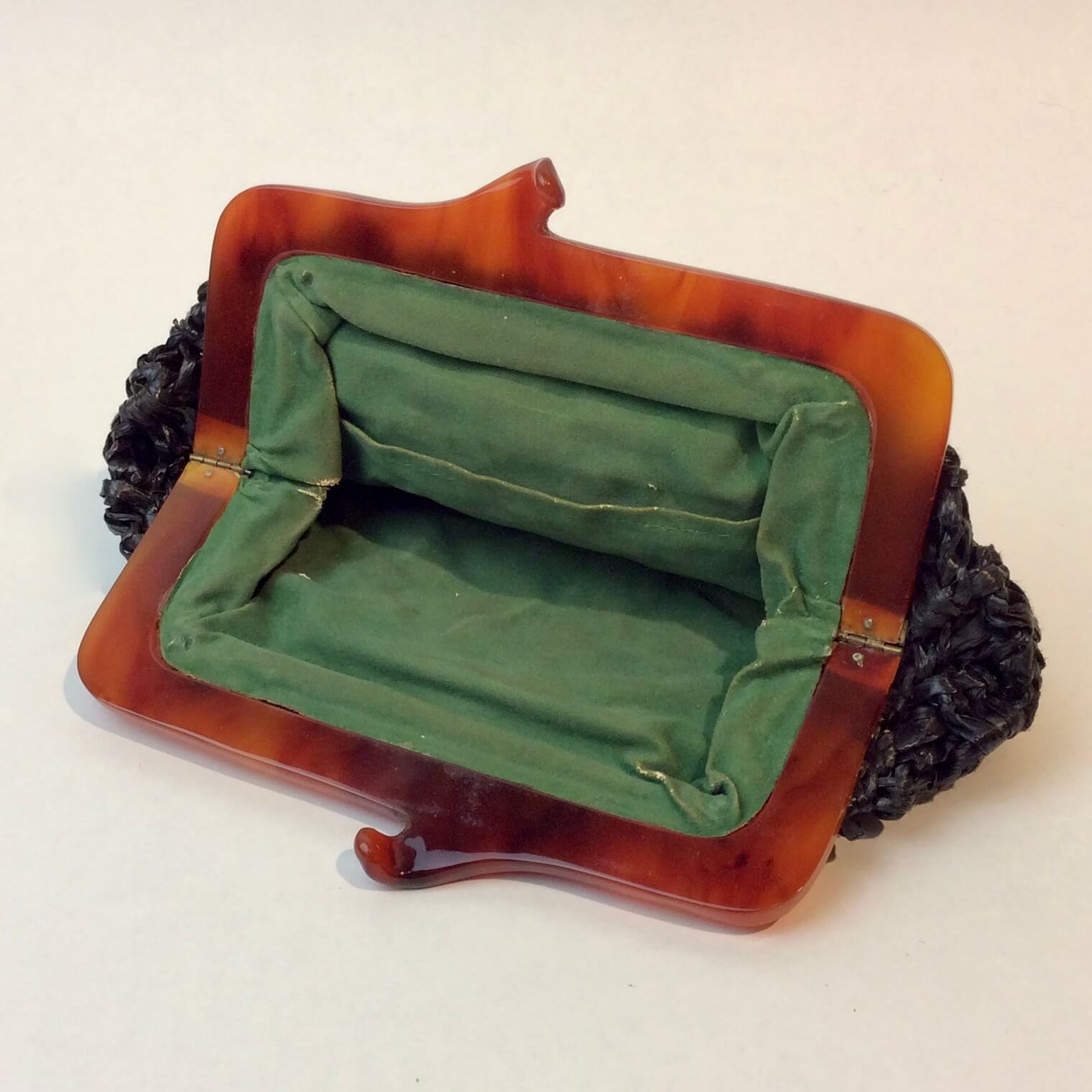 Inside of 1960s Small Black Crocheted Raffia Evening Clutch sold at bohemevintage.com Montreal