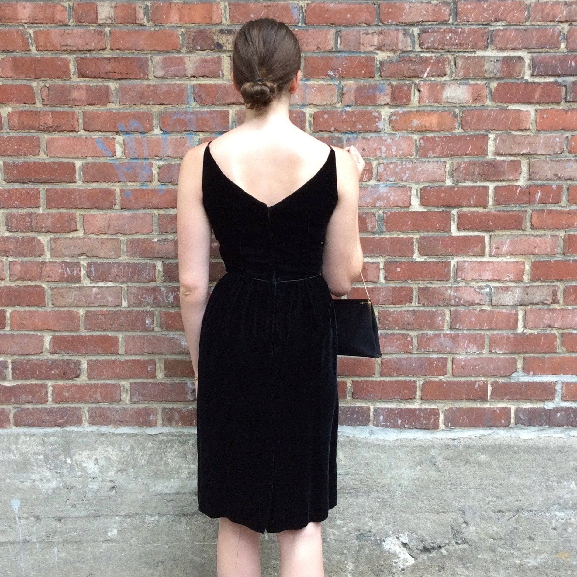 Back view of 1950s/1960s Black Velvet Sleeveless Cocktail Dress Size Small sold by bohemevintage.com Montréal