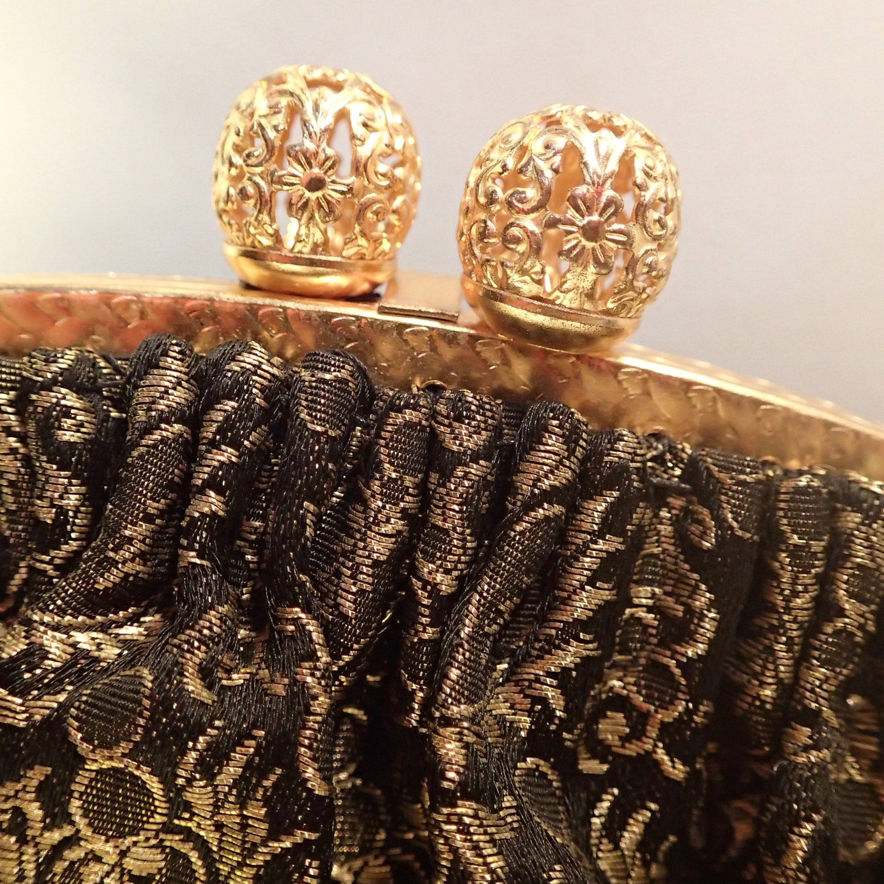 Black and gold brocade bag clasp