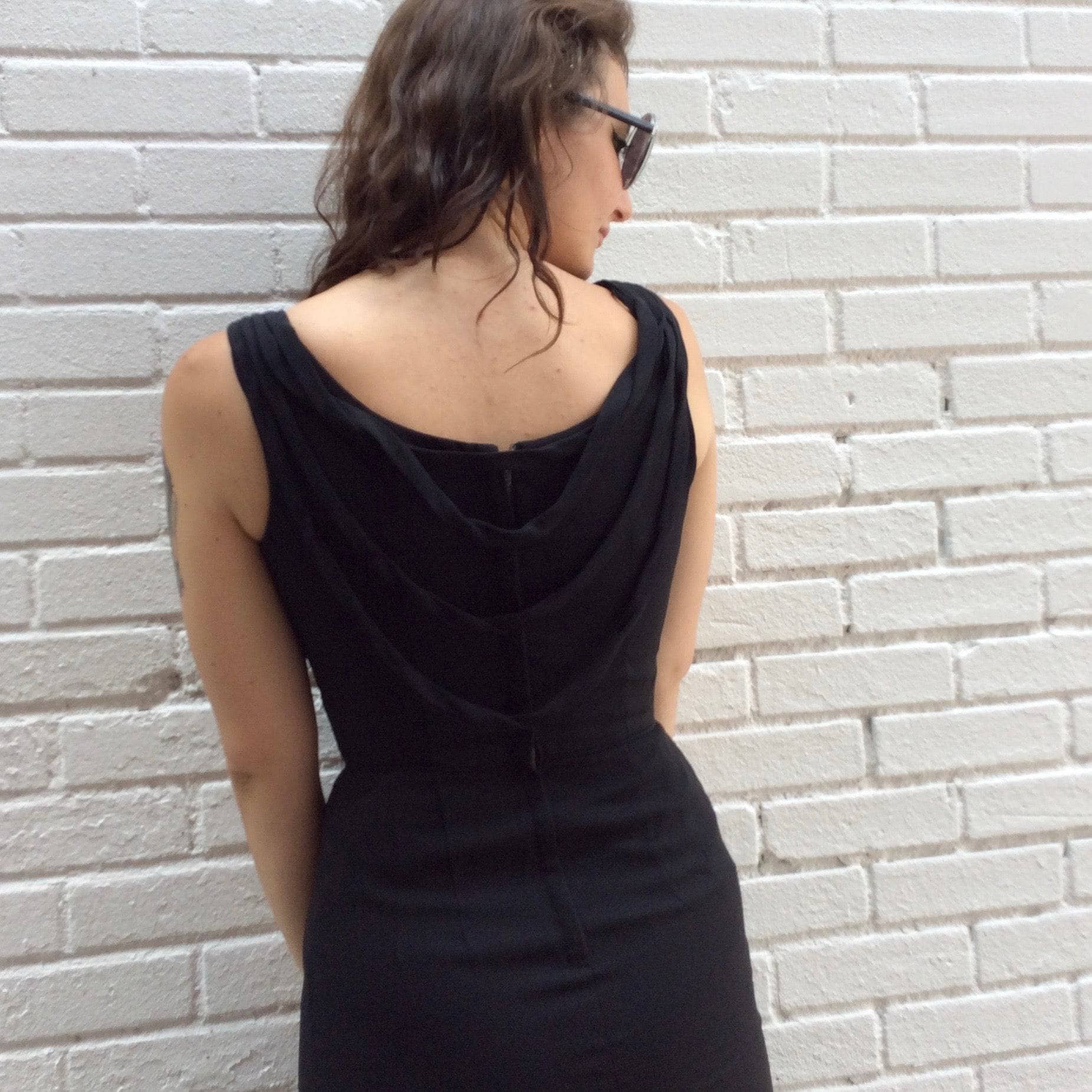 Back view of 1950s Black Open-Back Cocktail Dress Size Small, Sold by bohemevintage.com Montréal
