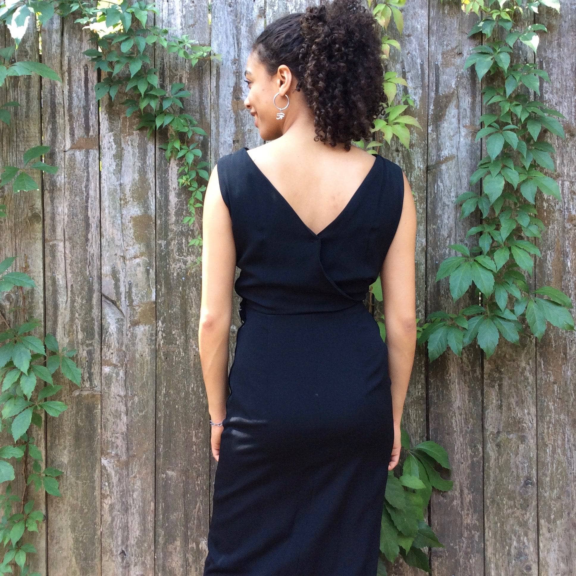 Back view of 1950s Black Maxi Sleeveless Wrapped Long Dress, size Small sold by bohemevintage.com Montreal