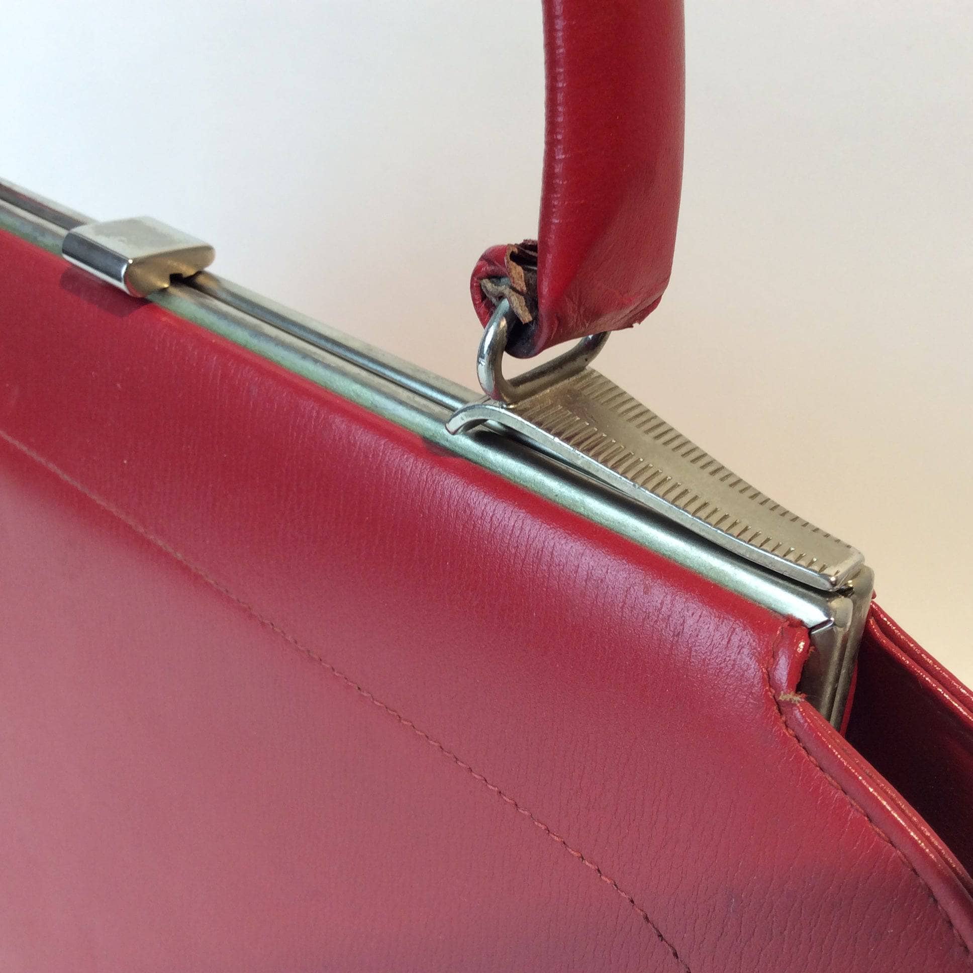 Detail View of Clasp of 1950s Red Handbag Sold by bohemevintage.com Montreal