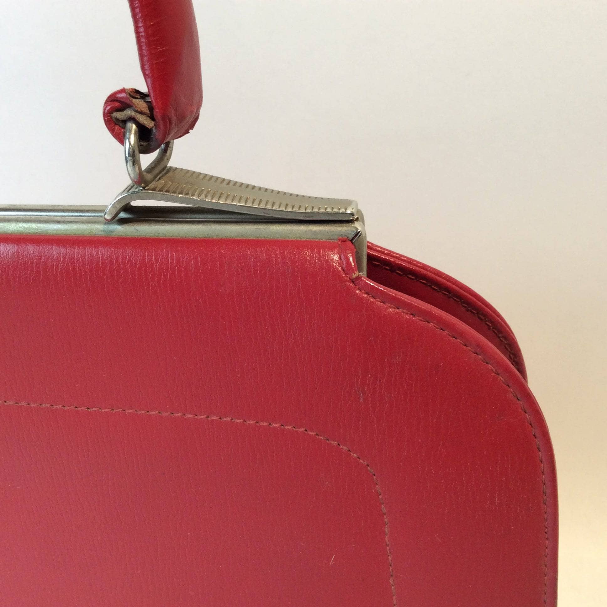 Detail View of Clasp of 1950s Red Handbag Sold by bohemevintage.com Montreal