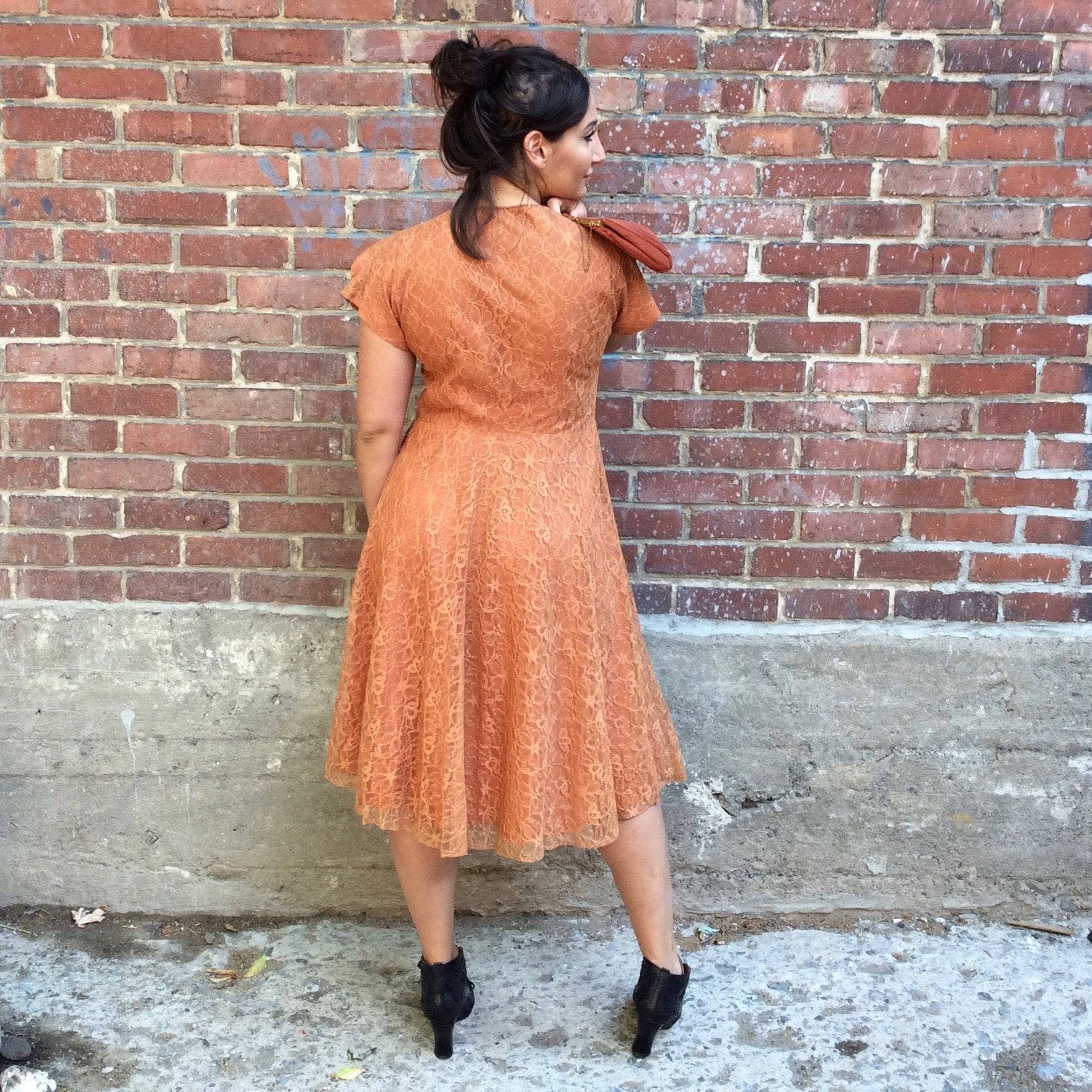 Back view of 1950s Short Sleeve Copper Lace Dress size Medium sold by bohemevintage.com Montreal