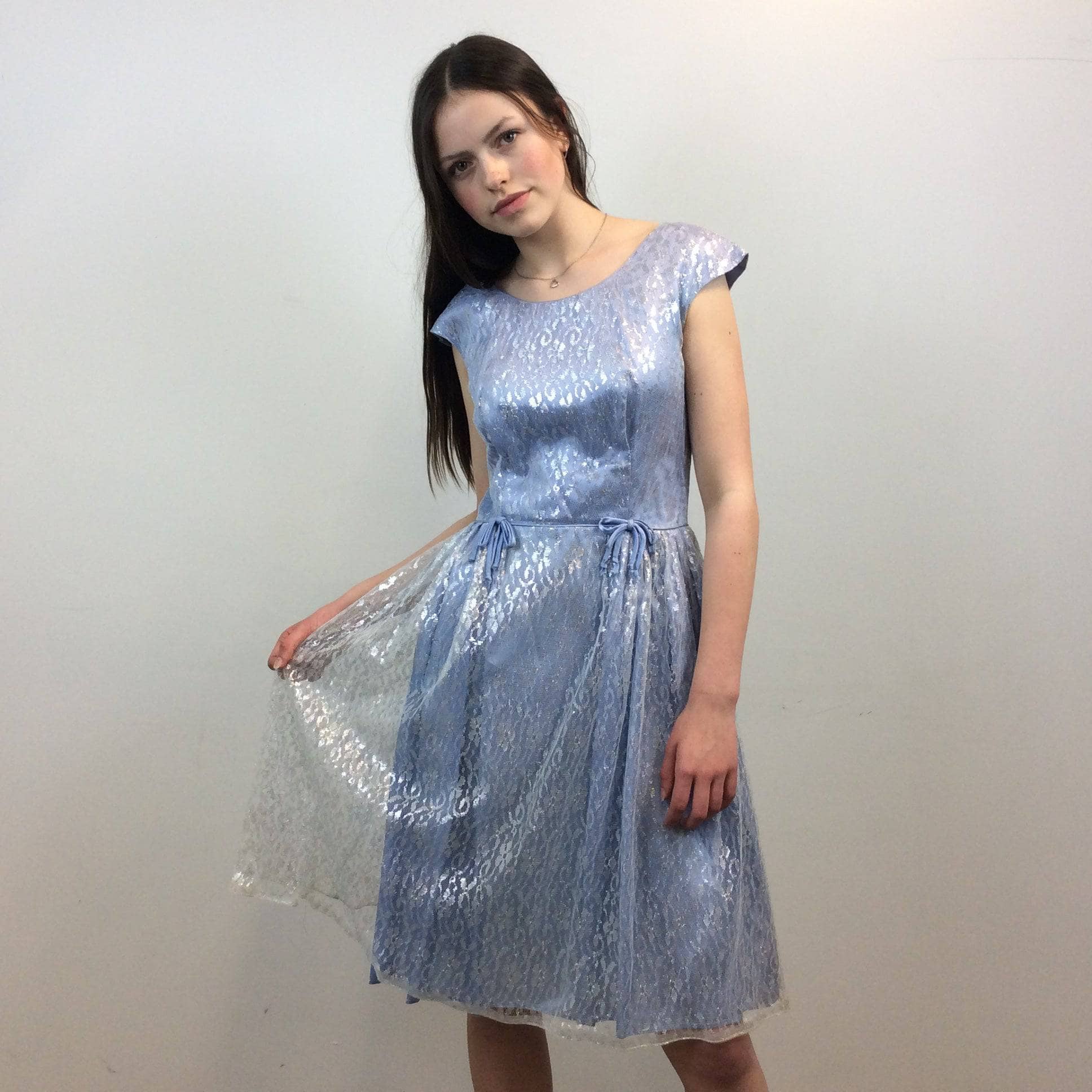 Front view of 1950s Silver Lace Party Dress, Fit and Flare Dress, size Small-Medium, Colour Blue sold at bohemevintage.com Montreal