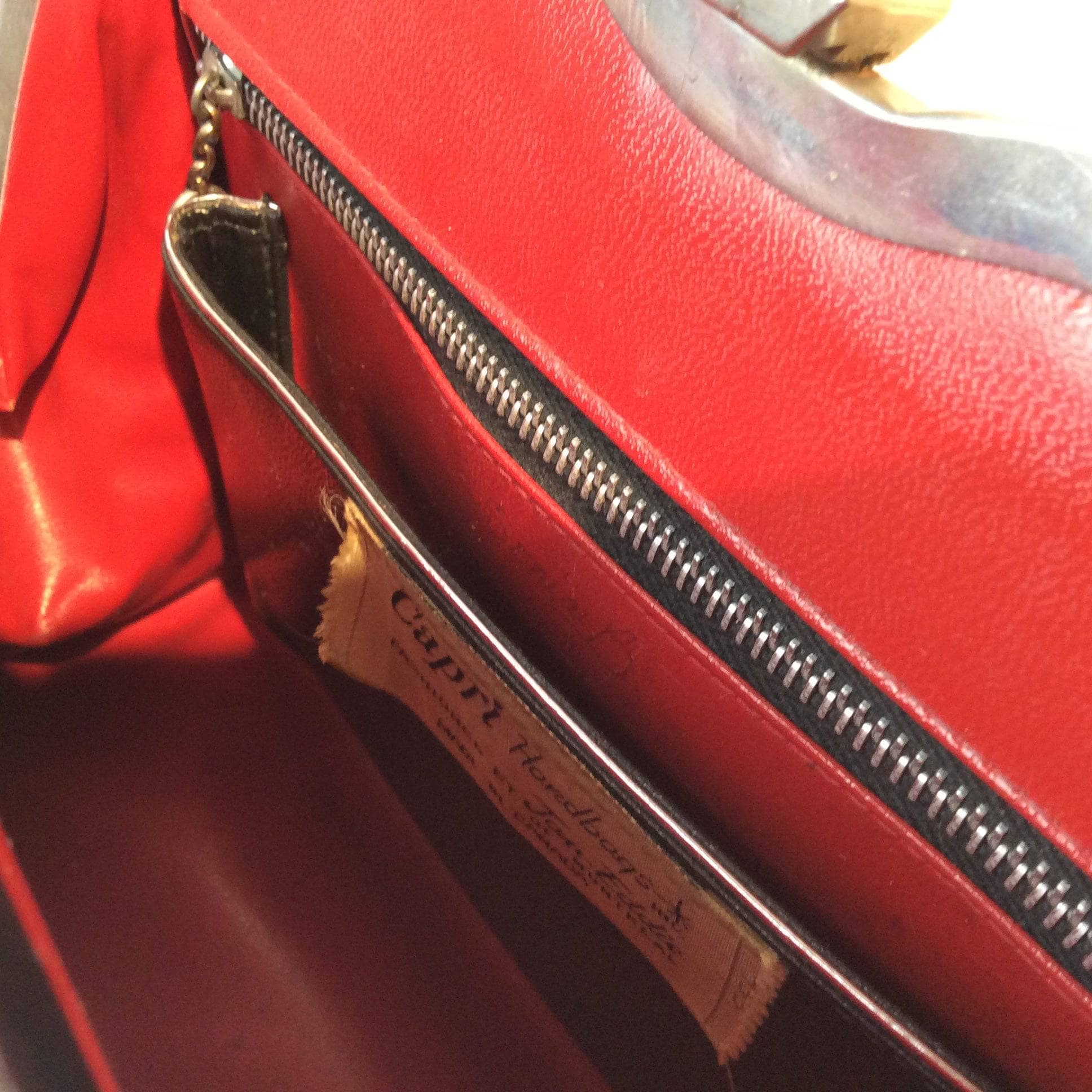 Inside view of 1950s "Capri" Up-cycled Black Leather Frame Handbag sold by bohemevintage.com Montreal