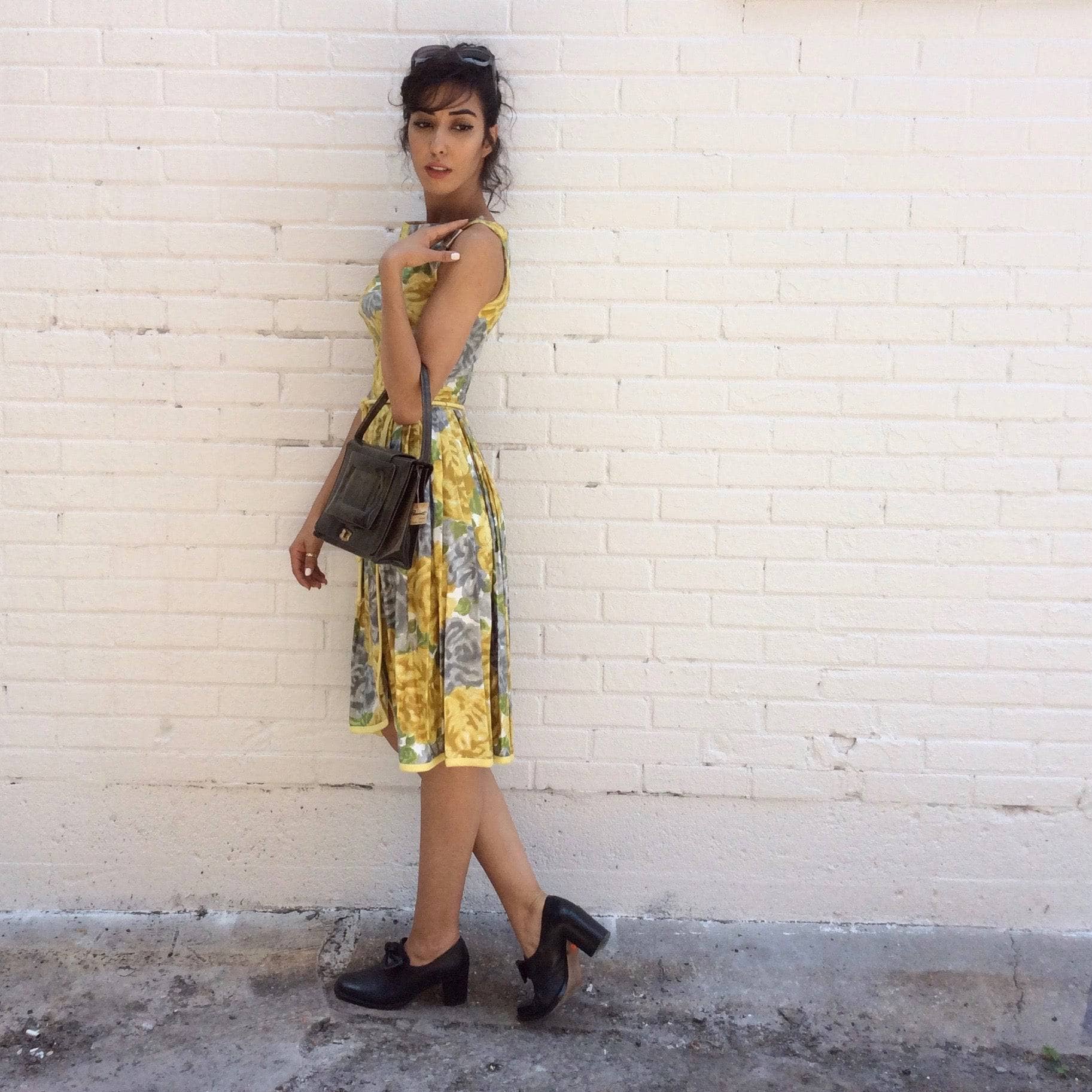 Side view of 1950s Yellow Floral Cotton Dress Size Small sold by bohemevintage.com Montreal