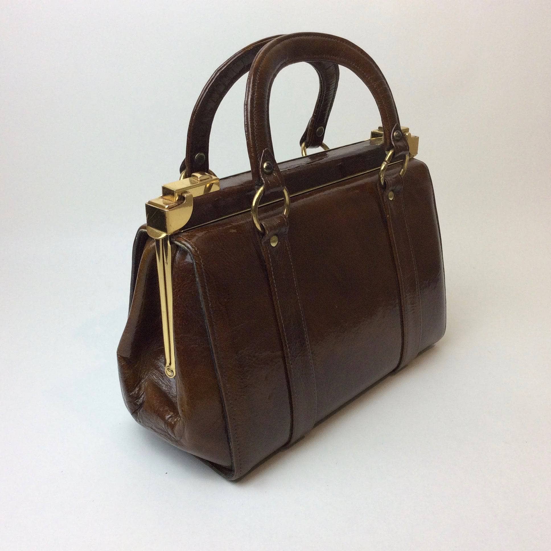 1960s Brown Patent Leather Frame Bag with 2 handles from Charisma. sold by bohemevintage.com Montréal