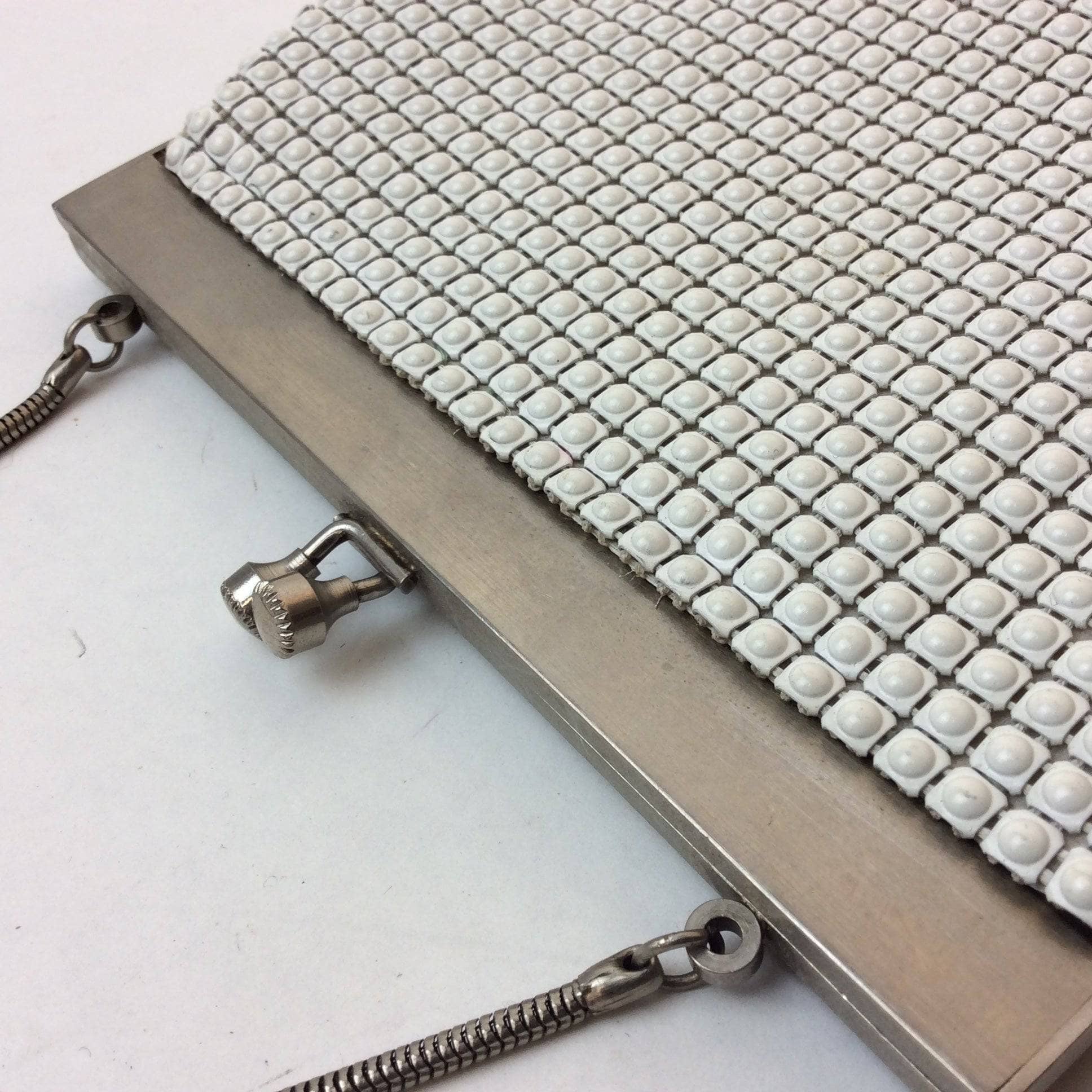 Close-Up of Clasps of 1960s "Geo Mercier" White Beaded Textured Evening Bag. Sold by bohemevintage.com Montréal