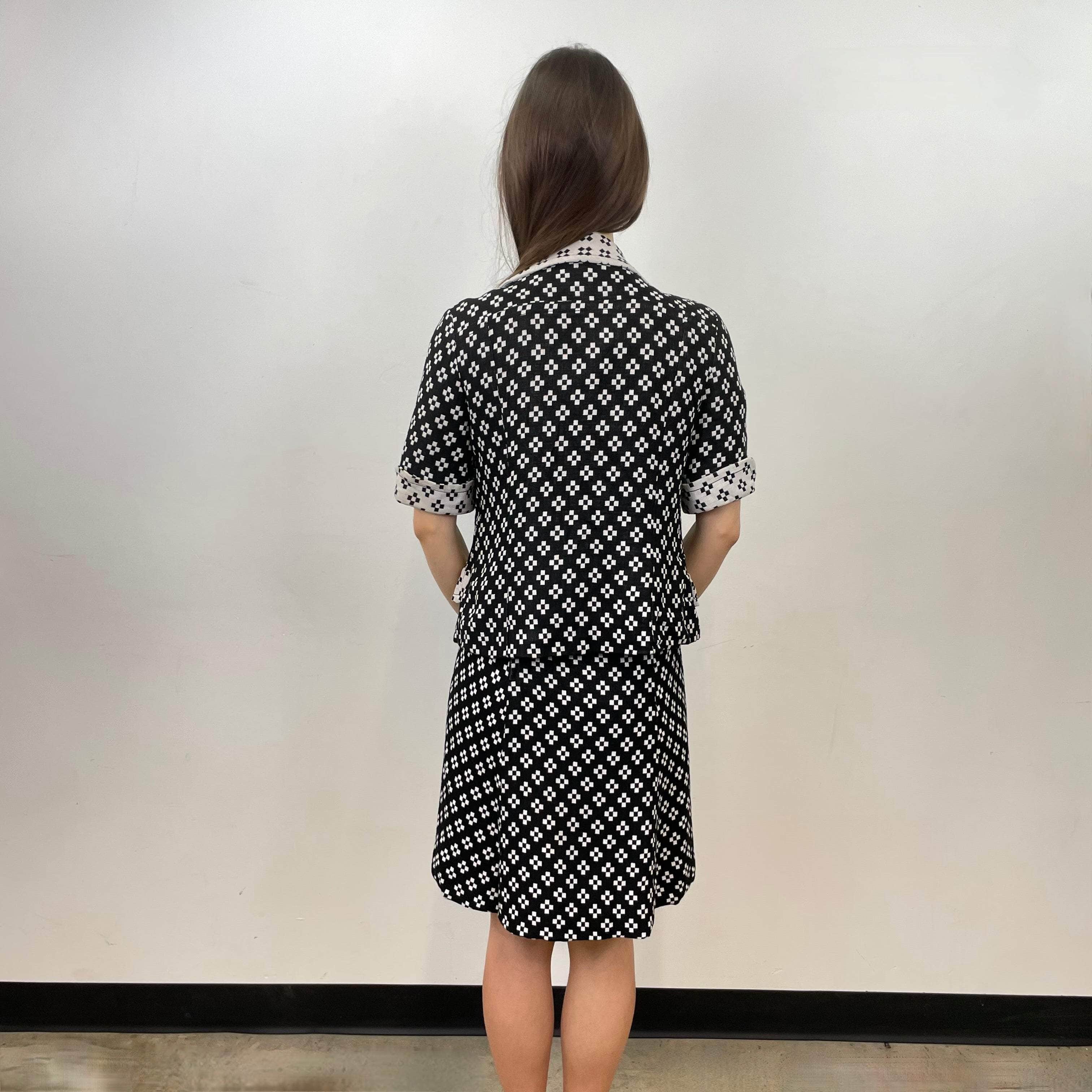 Back view of 1960s Holt Renfrew Black and White Dress and Blazer Set Size small Sold at bohemevintage.com Montreal