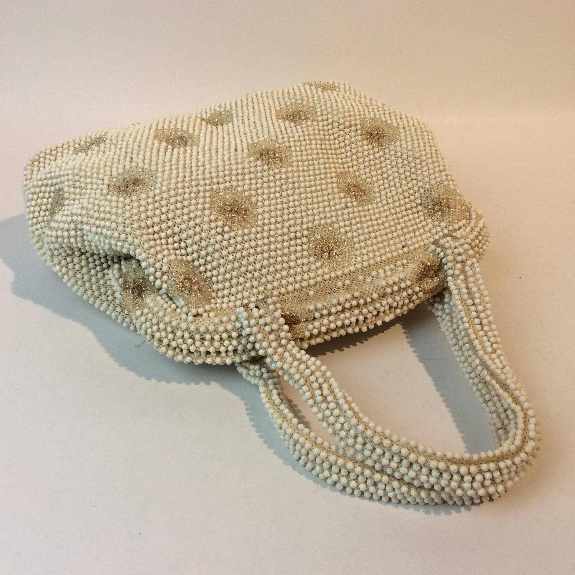 1960s Ivory Grandee Beaded Soft Shell Handbag sold by bohemevintage.com Montreal