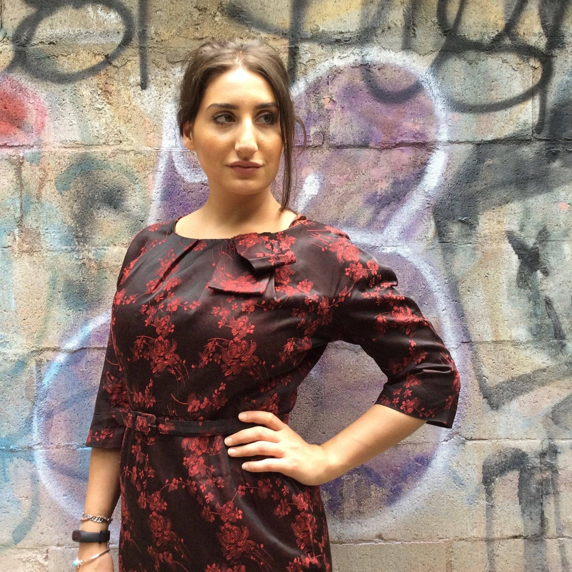 Left side view of 1960s Red and Black Floral Satin Brocade Sheath Cocktail Dress. Sold by bohemevintage.com Montreal