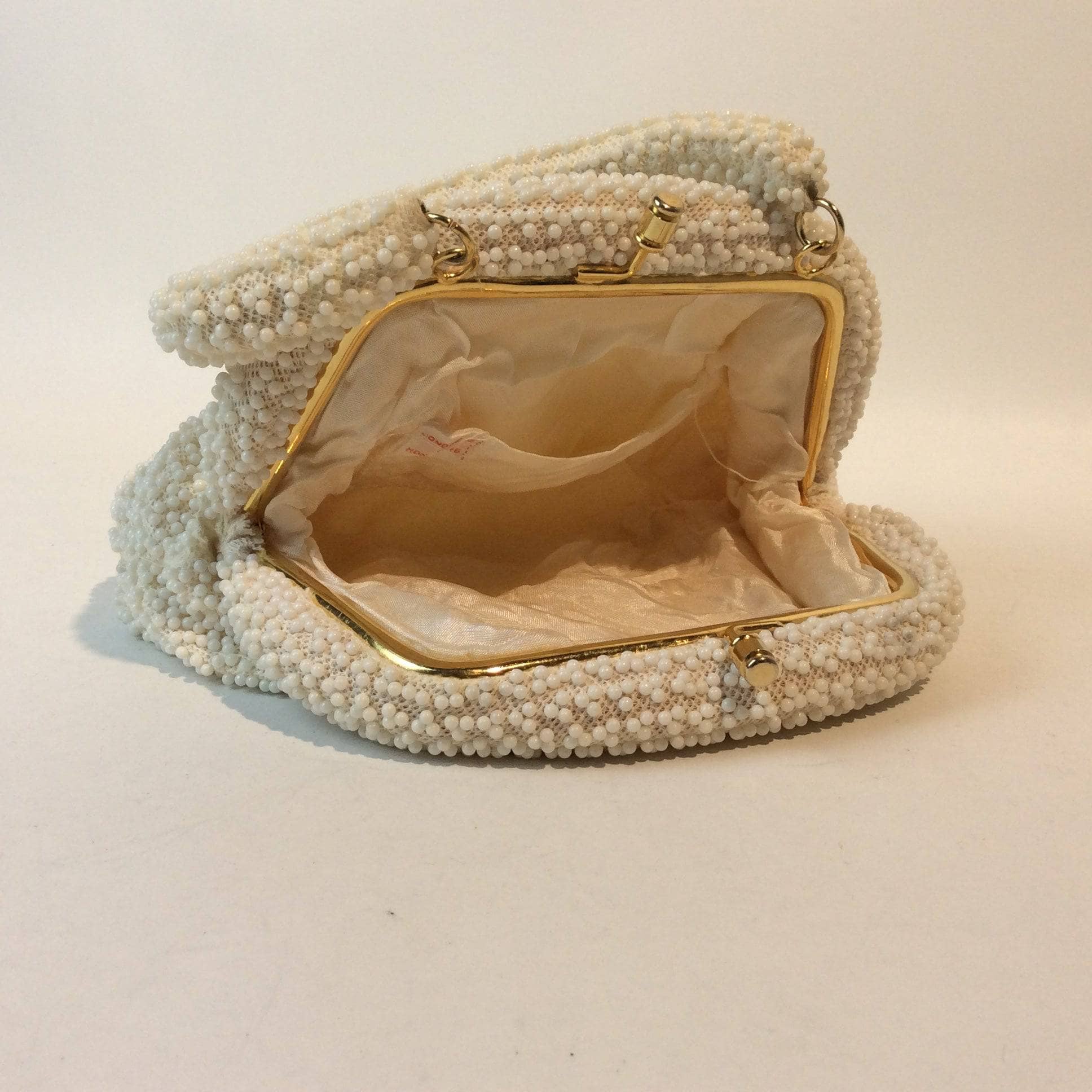 Open view of Corde-Bead 1960s White Beaded Soft Shell Evening Bag. Sold by bohemevintage.com Montreal