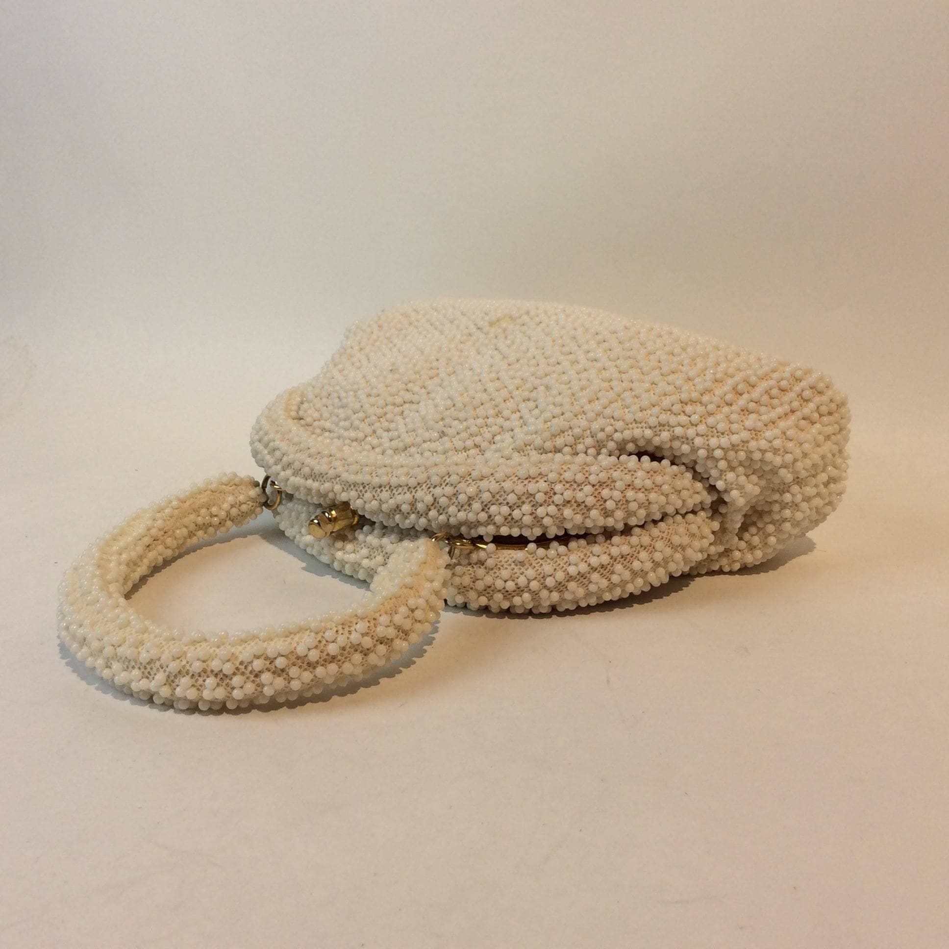 Corde-Bead 1960s White Beaded Soft Shell Evening Bag. Sold by bohemevintage.com Montreal