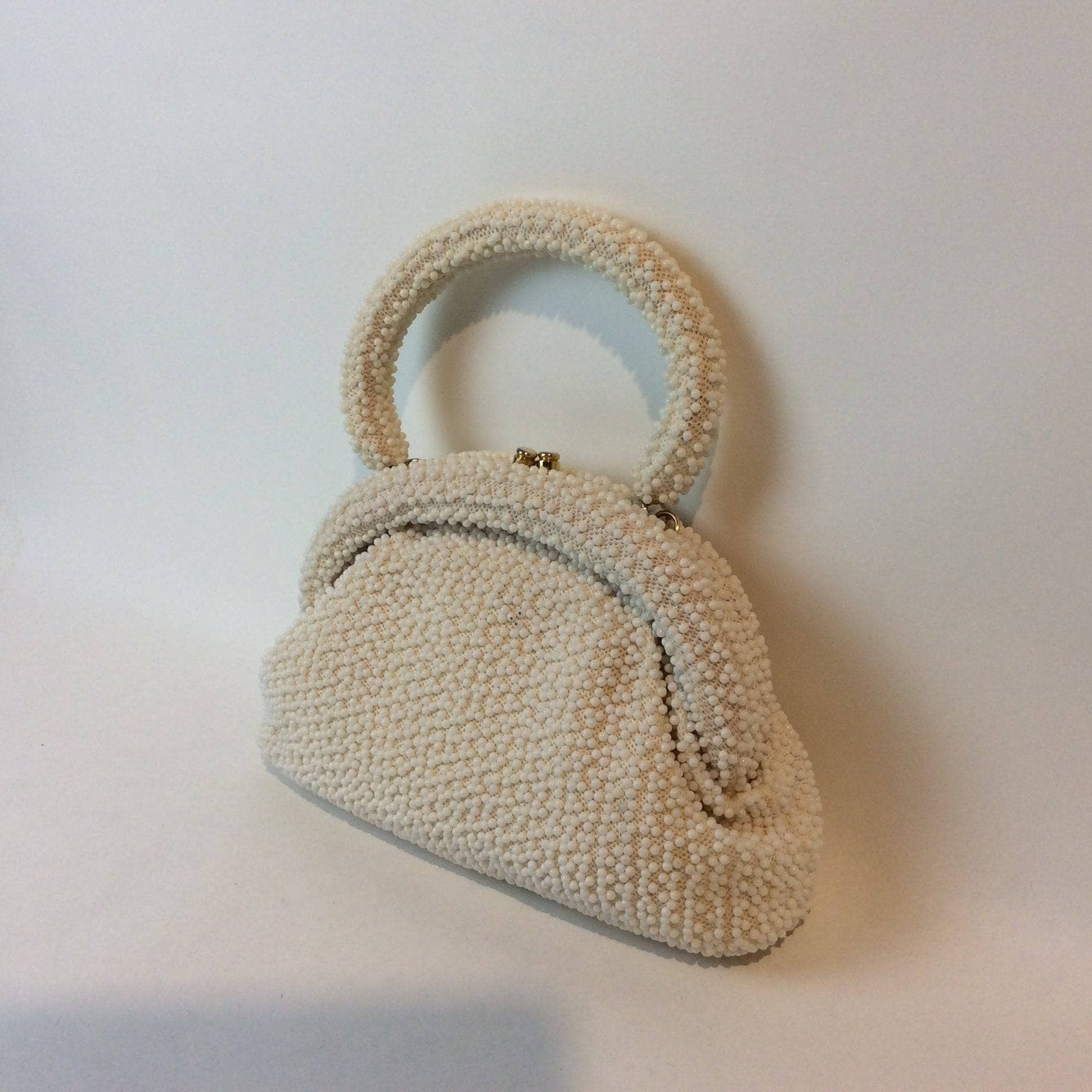 Corde-Bead 1960s White Beaded Soft Shell Evening Bag. Sold by bohemevintage.com Montreal