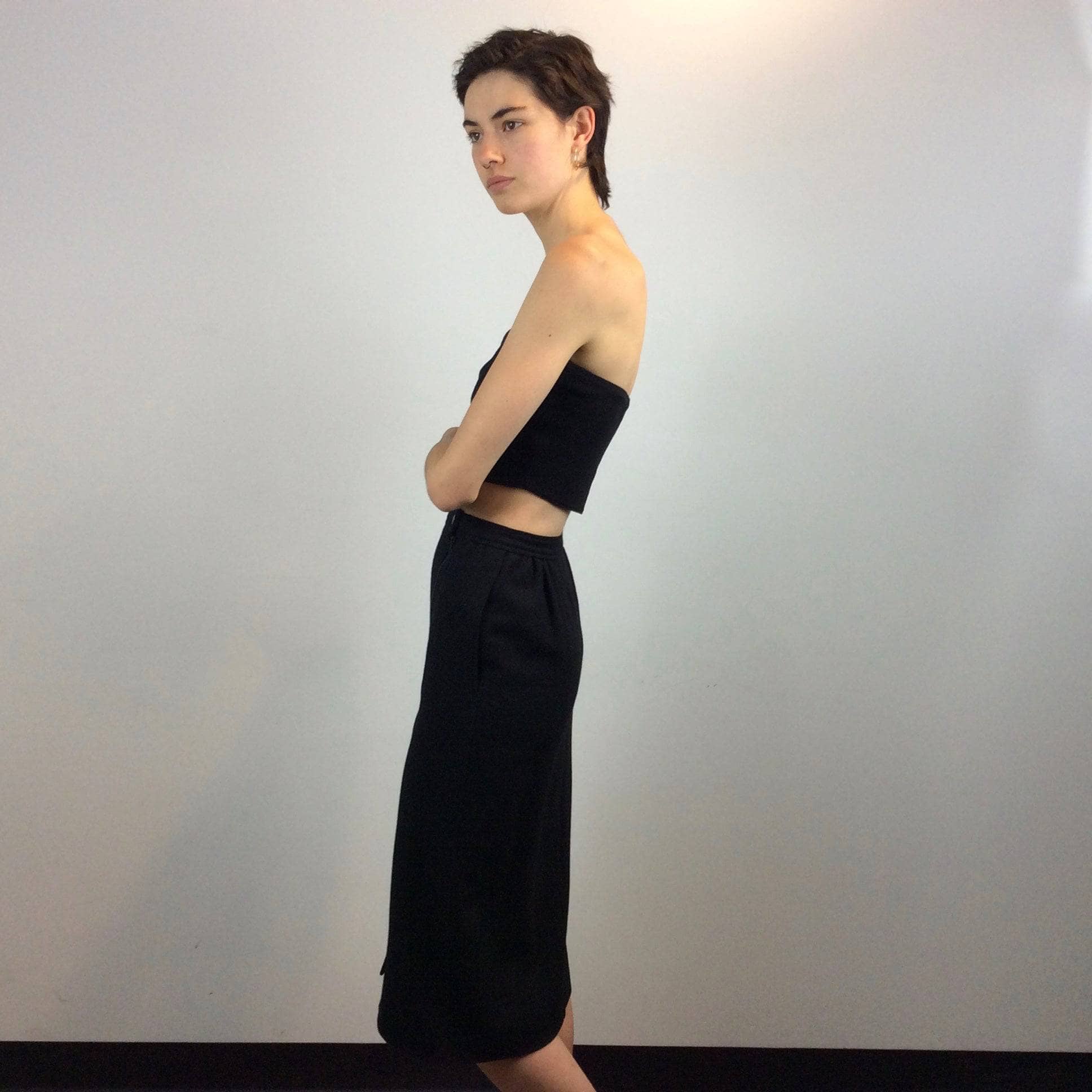 Side view of 1970s-1980s Courrèges Black Cashmere and Wool Midi Pencil Skirt Size Small Sold by Boheme Vintage Montreal