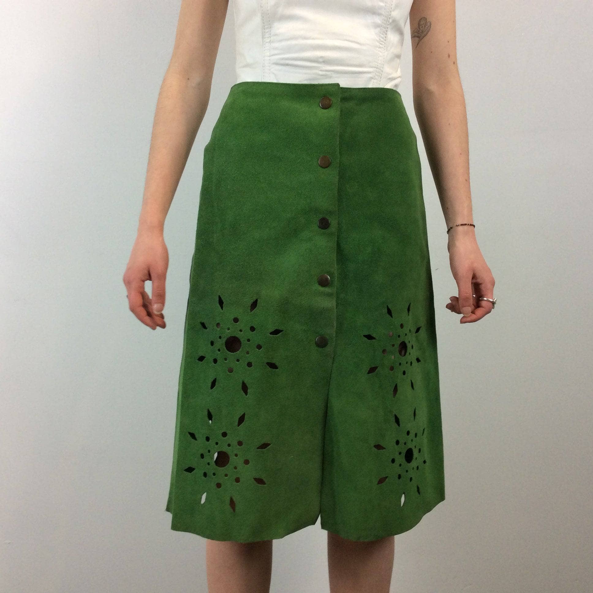 1970s Cut Out Green Suede Skirt sold by bohemevintage.com Montréal