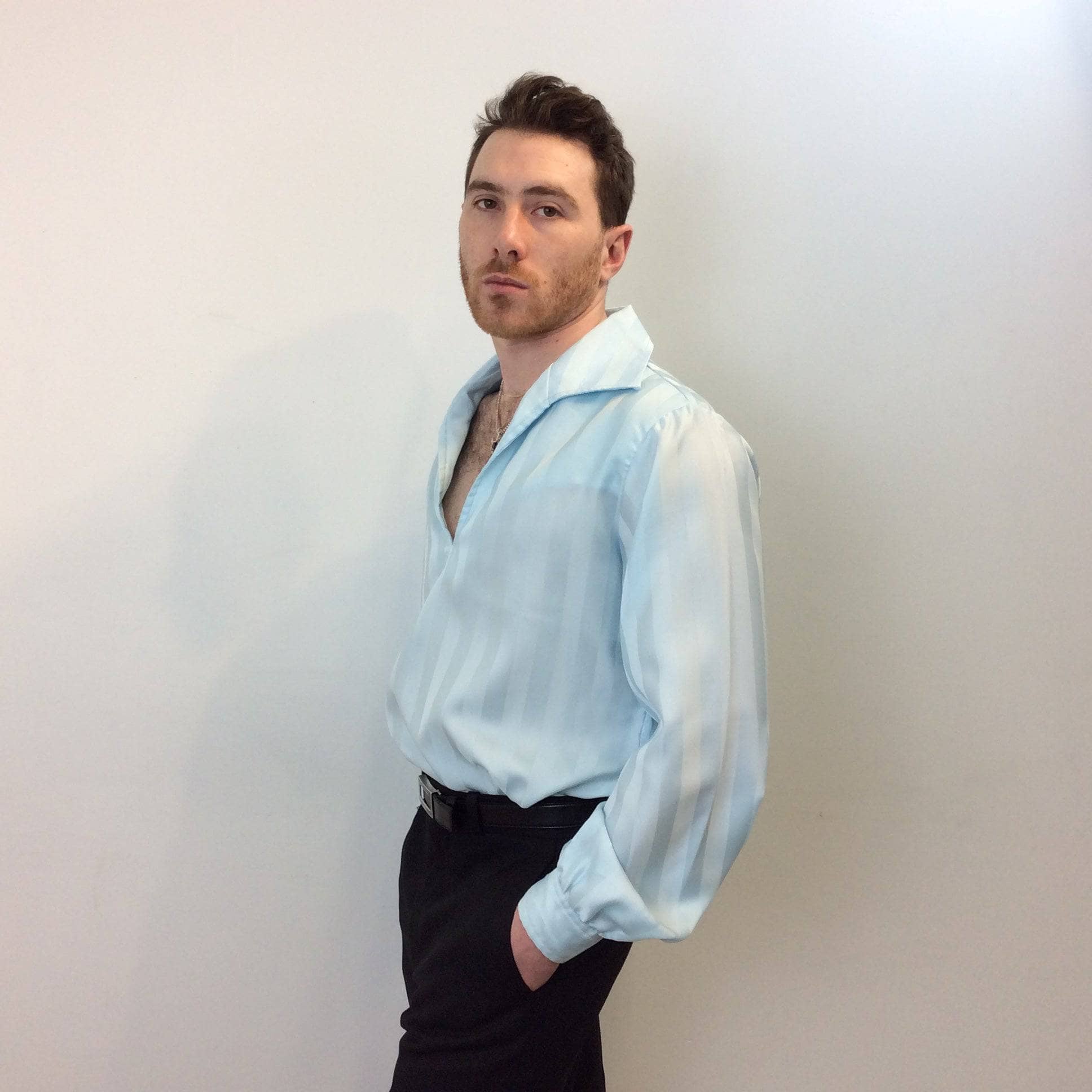 Side view of 1970s Disco Men's Light Blue Popover Disco Shirt, sold by bohemevintage.com Montréal