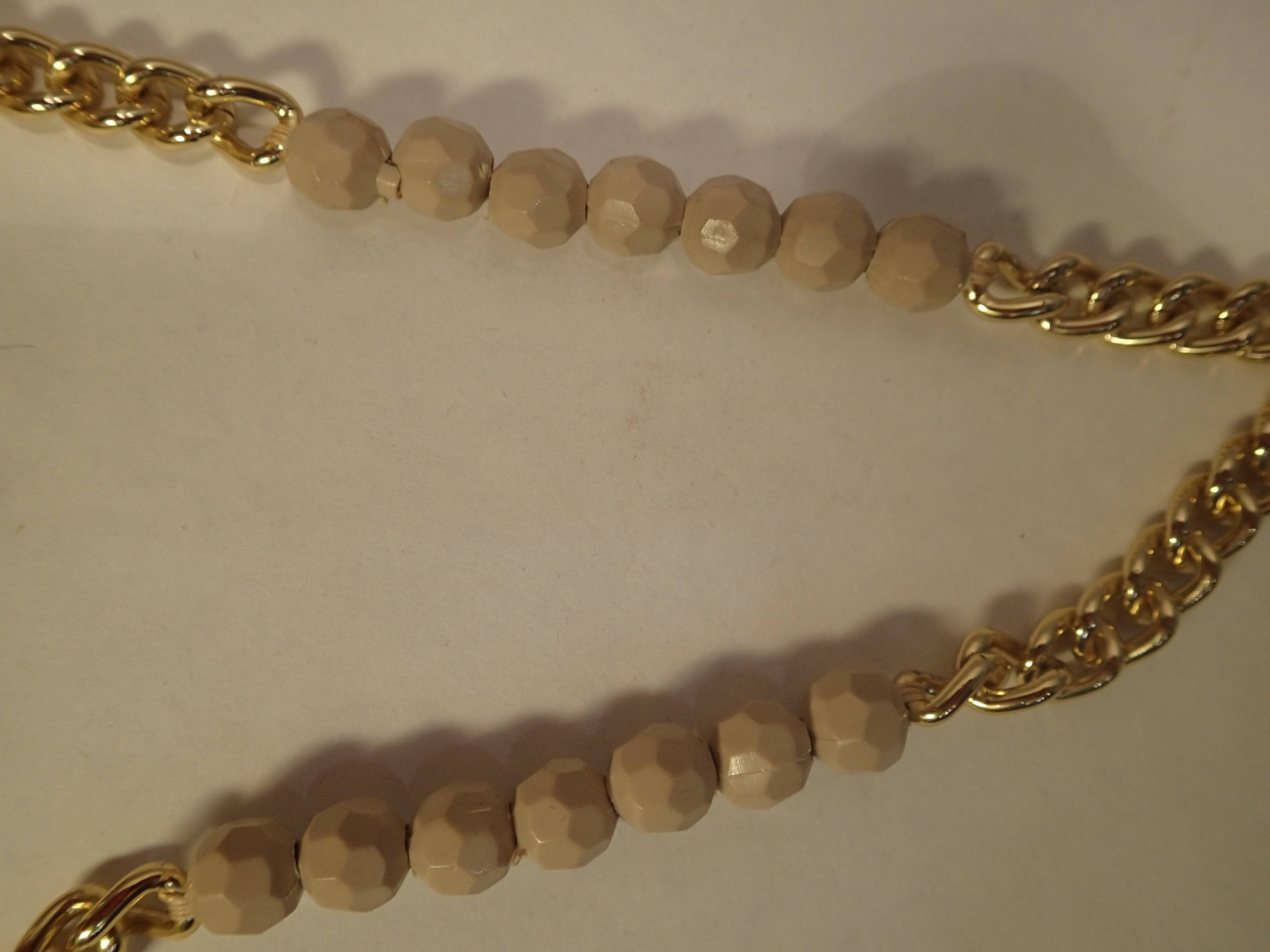 Wood beads and gold chain string detail of 1970s Multi-Coloured Tassels and Crochet Fantasy Bag, sold by bohemevintage.com Montréal