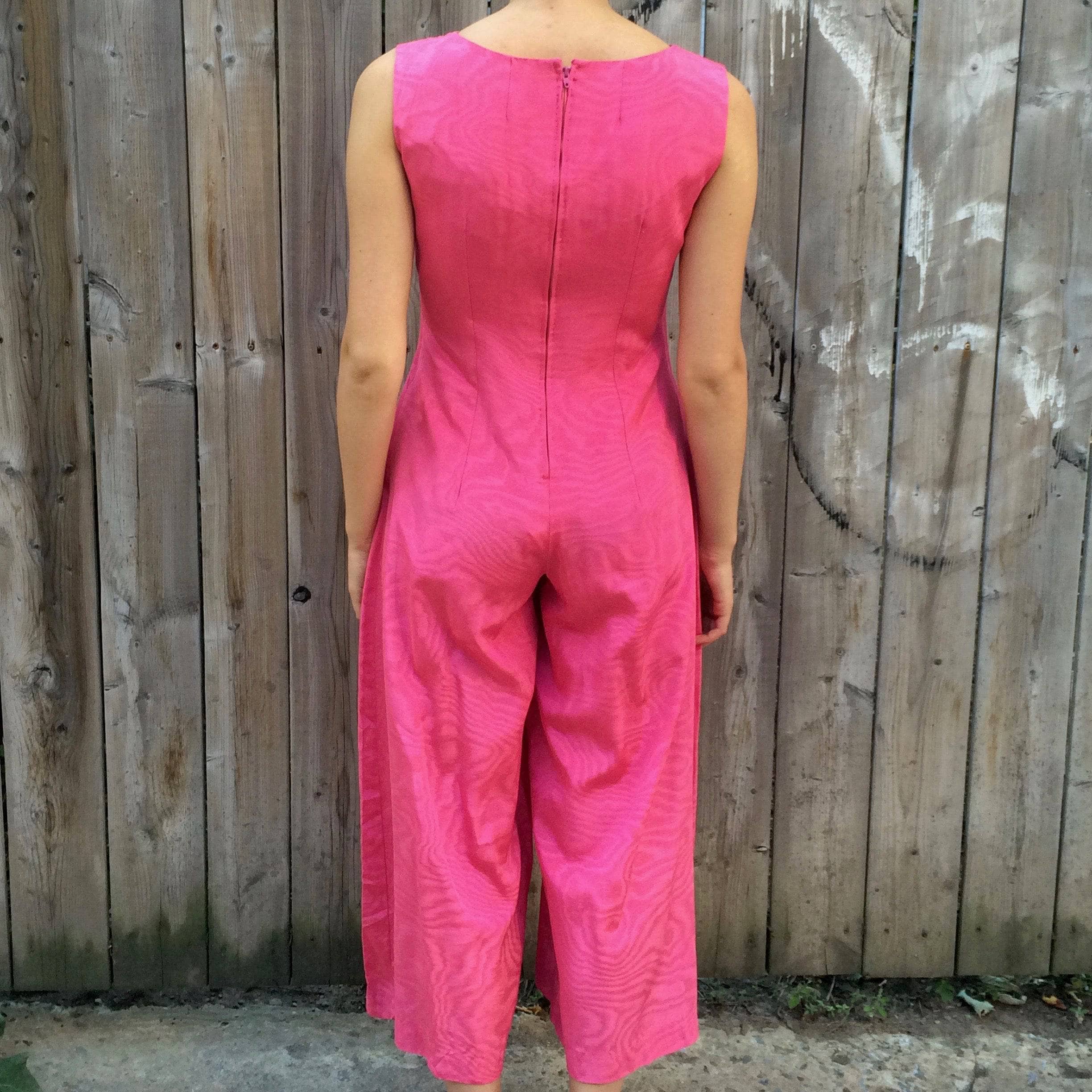 Back view of 1970s Dressy Plunging Neckline Wide Leg Pink Jumpsuit Small sold by bohemevintage.com